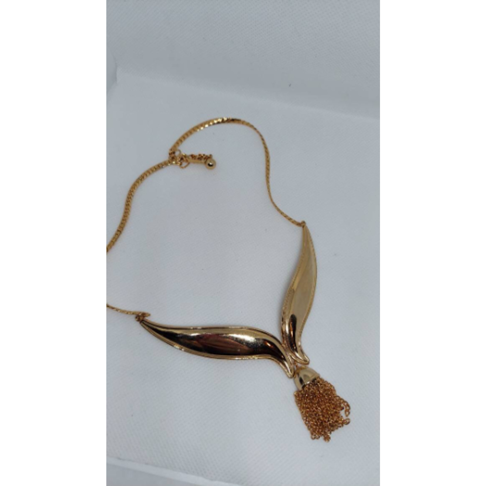 Vintage Avon tassel necklace V whale tail gold tone