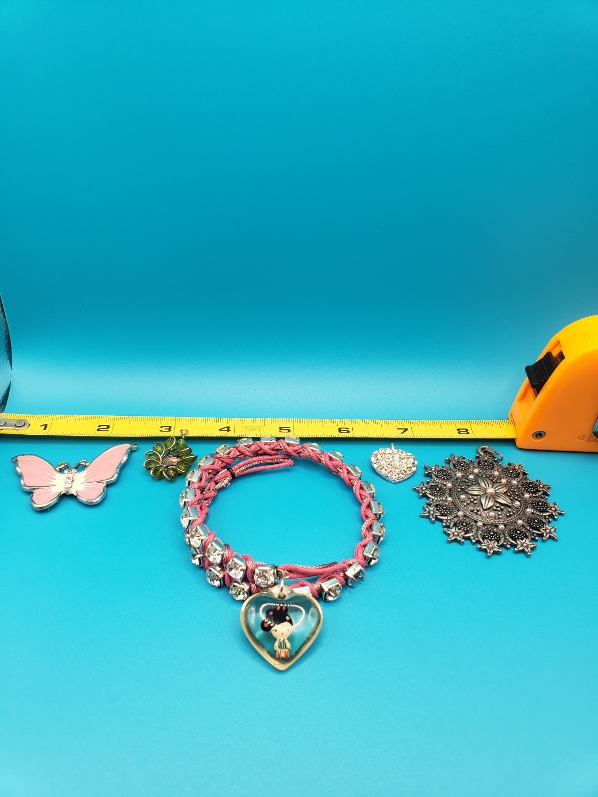 Mixed Costume Jewelry Lot: Pendants, Brooches, Rhinestone Bracelet & More