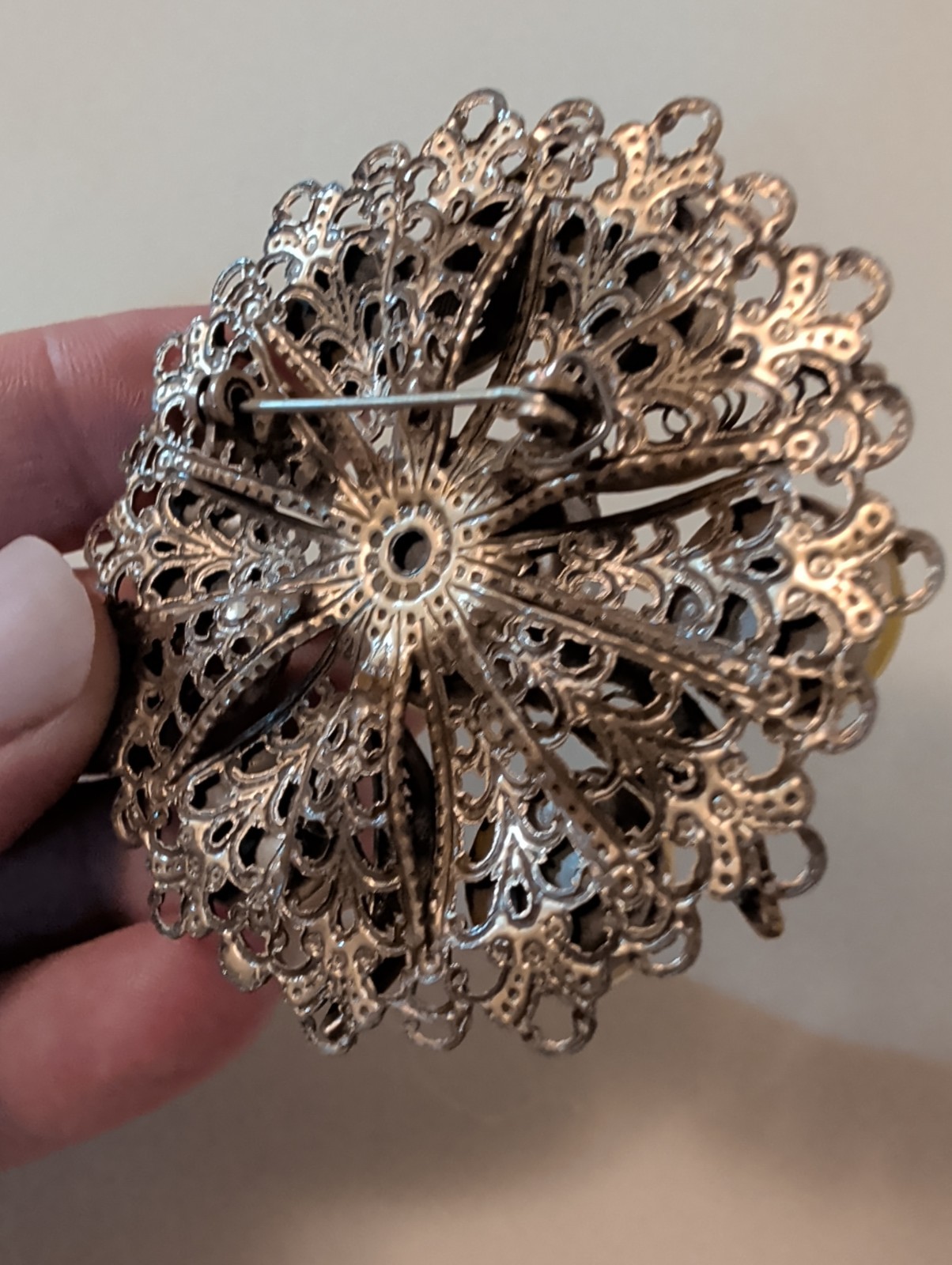 Vintage filigree Bronze Tone Brooch. UV Reactive. 2.5″