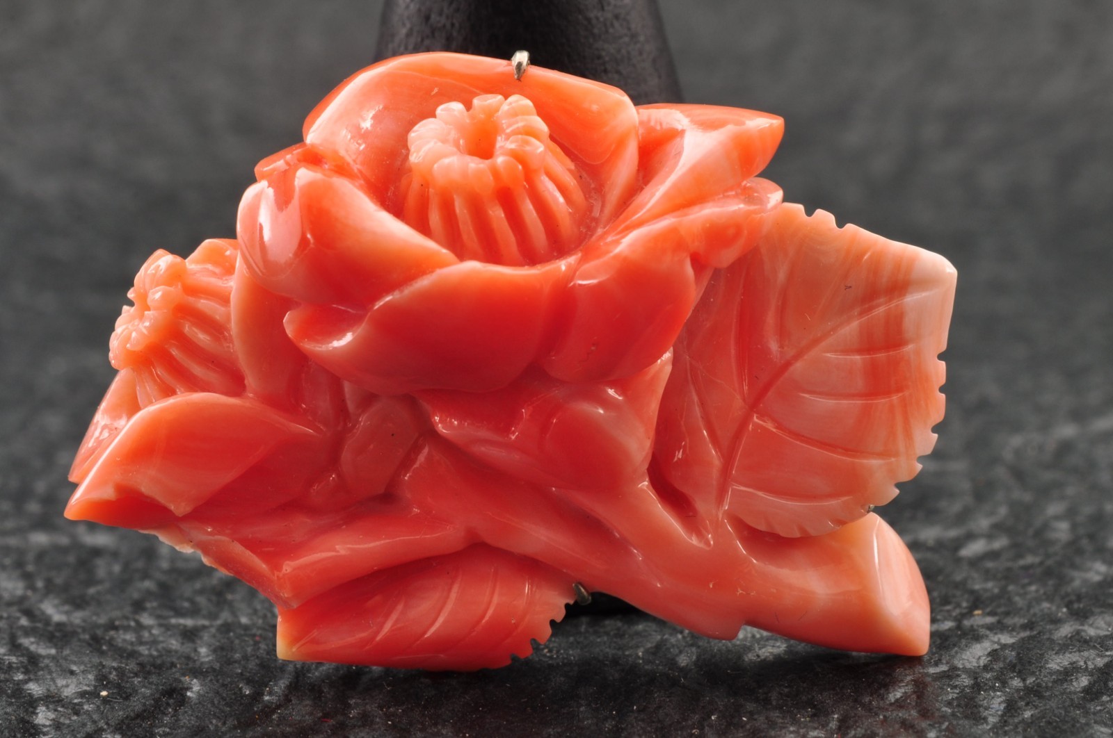 Pink coral OBIDOME, carved “camellia” (38mm (1.49in) total 50.0ct) Certificate.
