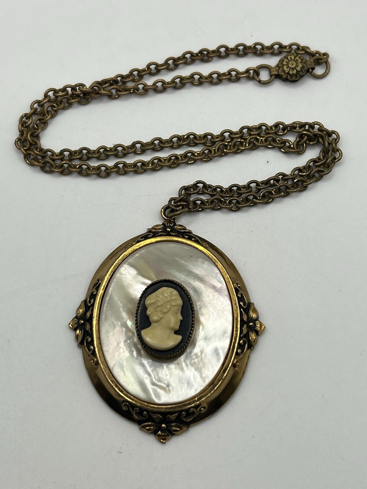Mother of pearl faux cameo pendant necklace with gold frame and chain