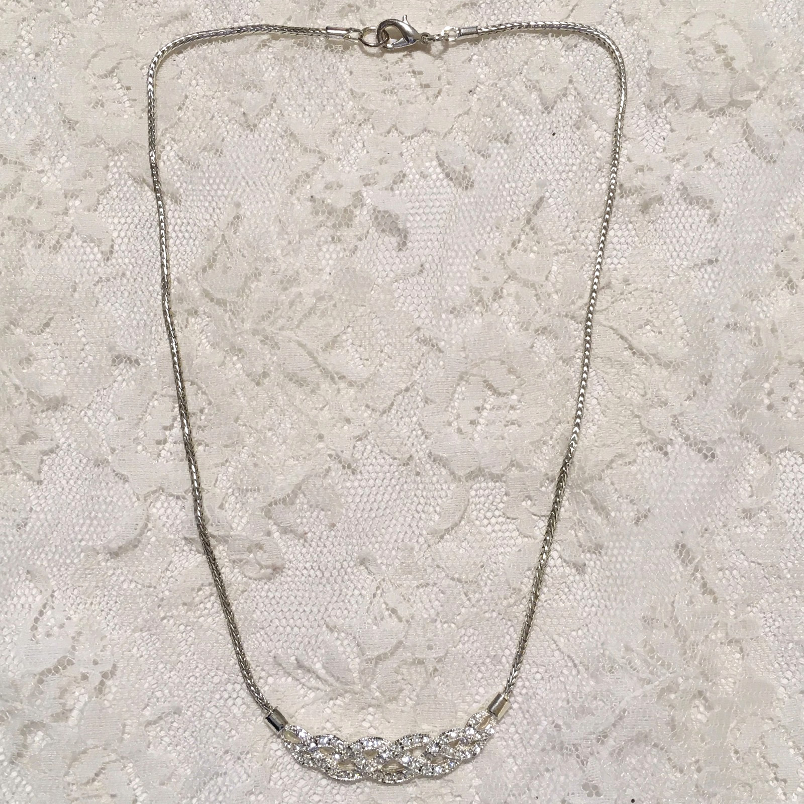 Vintage Interwoven Curved Pendant Necklace Roman signed Rhinestones Silver tone