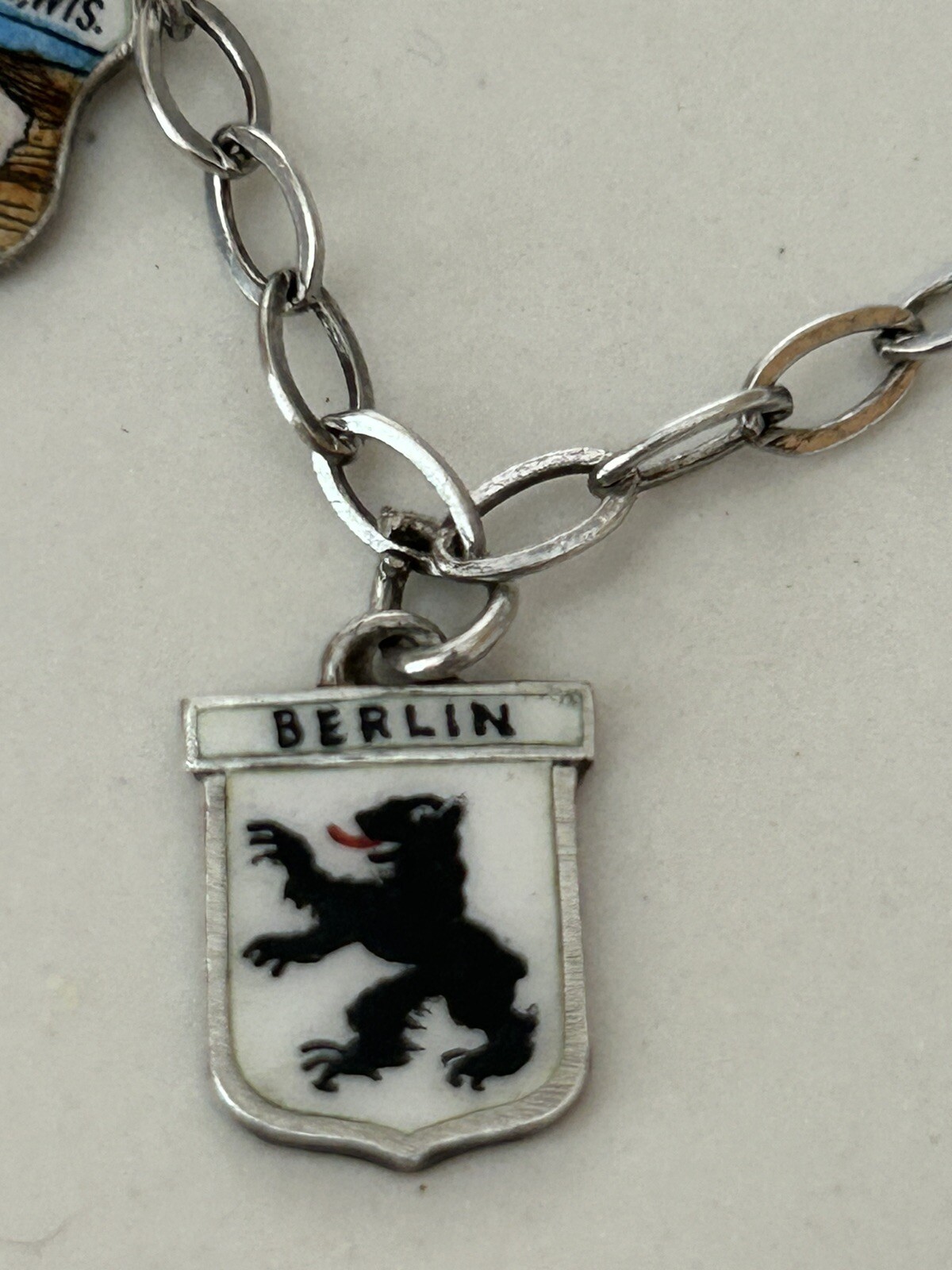 VINTAGE SOLID SILVER AND ENAMEL TRAVEL CHARM BRACELET6 COAT OF ARMS (8 TOTAL)