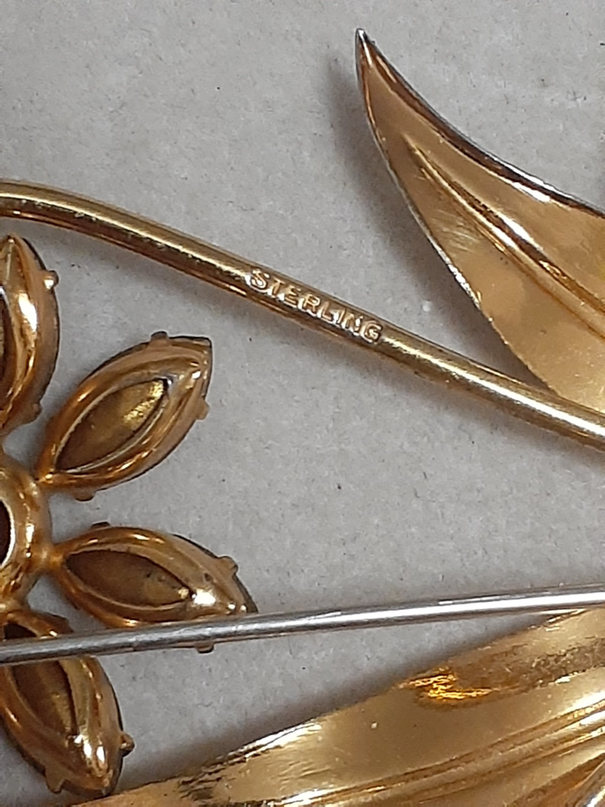 Sterling silver gold plated prong set purple glass flower & stem leaf brooch