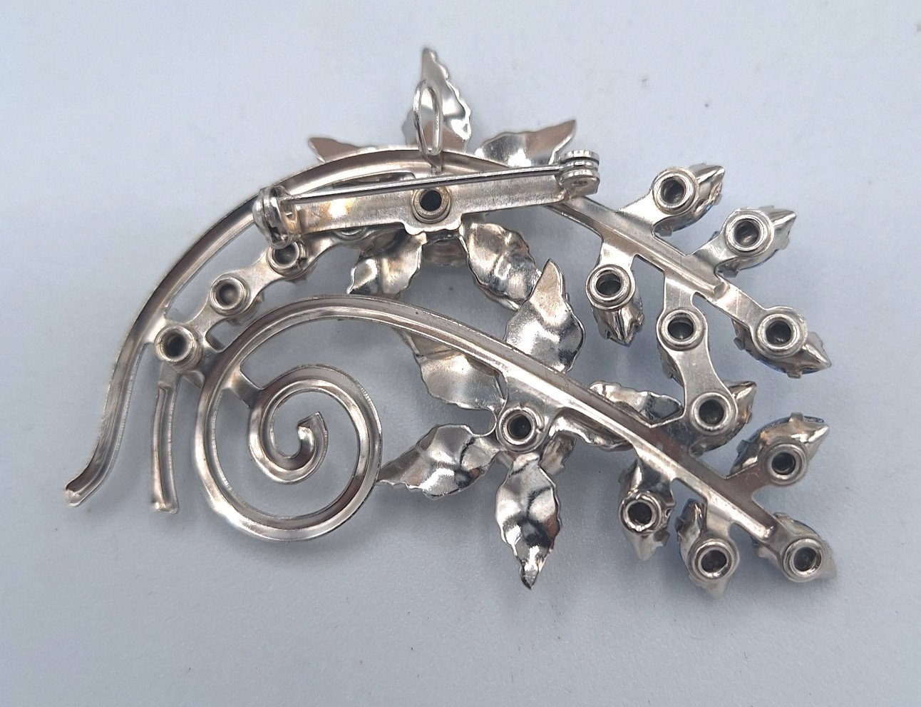 Unsigned Bugbee & Niles? Silver Tone Floral Spray Clear and Blue Flower Brooch