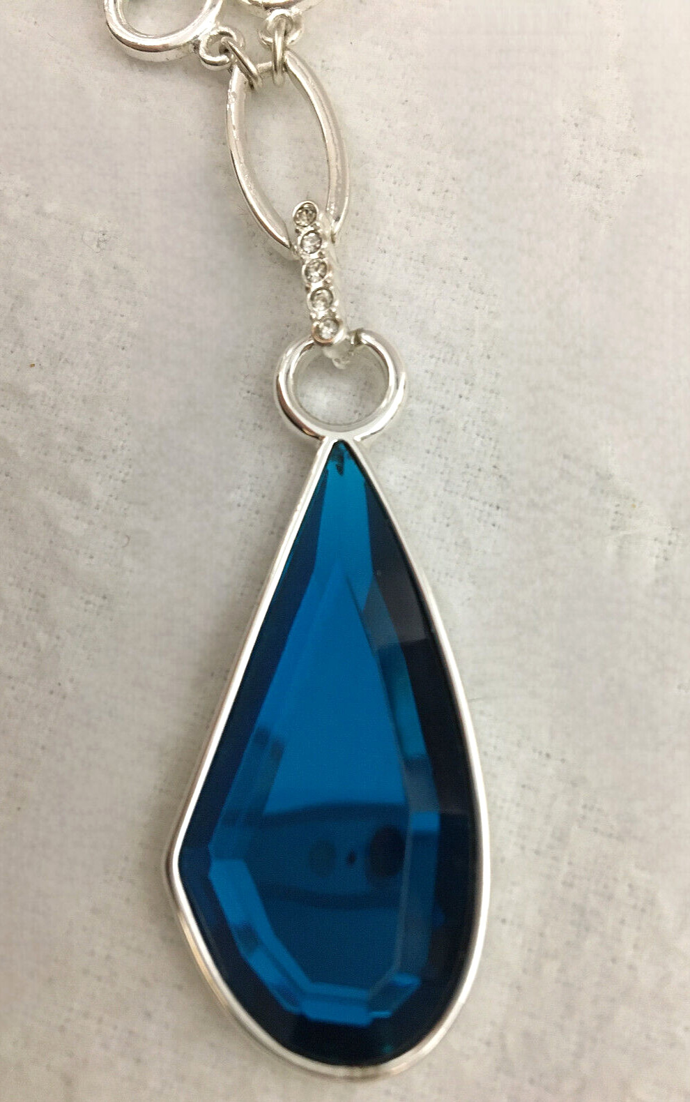 Silver Tone Necklace Blue Faceted Teardrop Pendant And Clear Rhinetone Accents