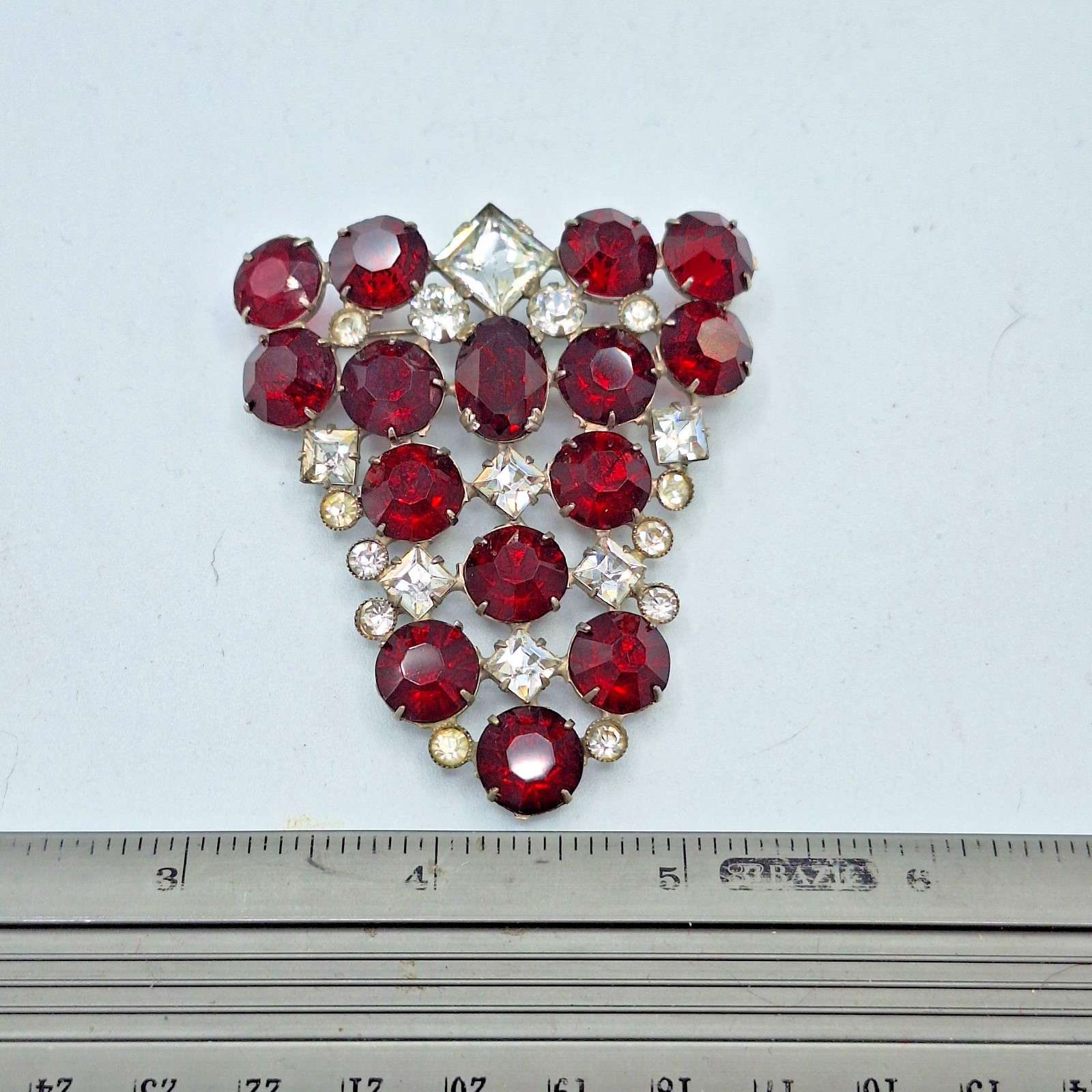 Red and Clear Rhinestone Triangular Brooch Unsigned 2.25″