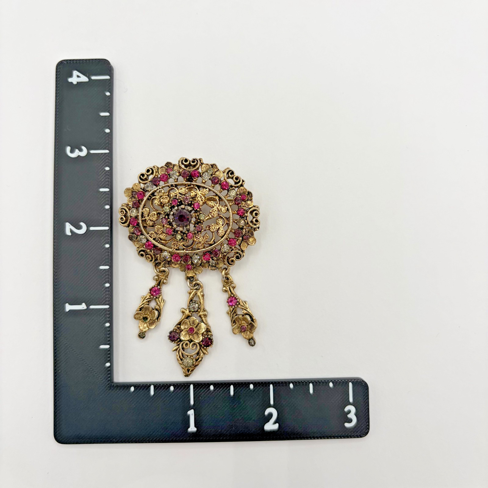 Vintage Kramer of New York Gold Tone Purple Rhinestone Dangle Brooch READ