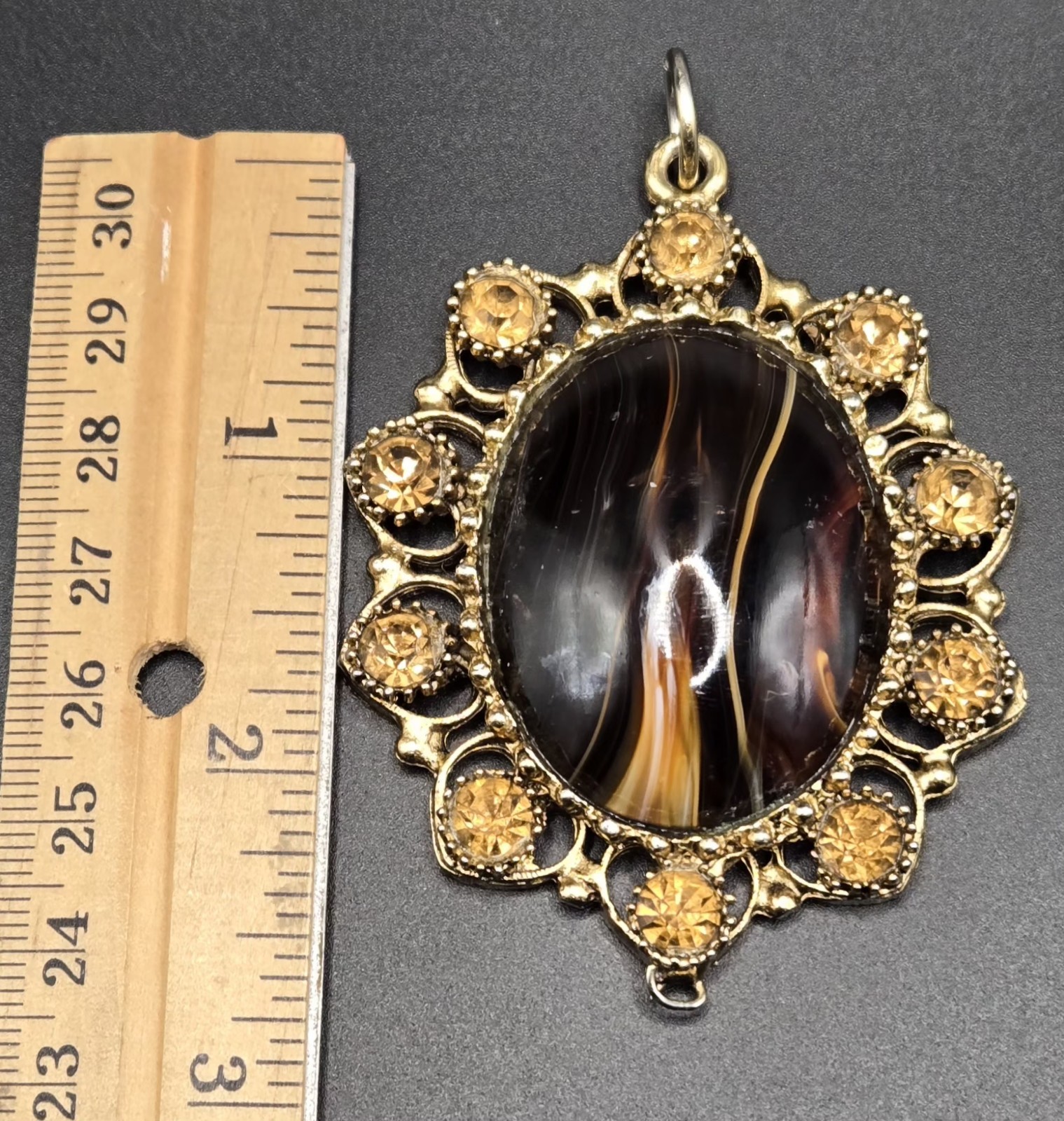 Vintage Ornate Gold Tone Oval Pendant Brown Black Stone Decorative Accents