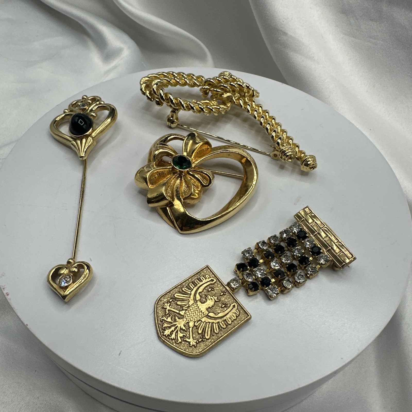 Three Mixed Vtg Gold Toned Brooches and One Pon.See pics.