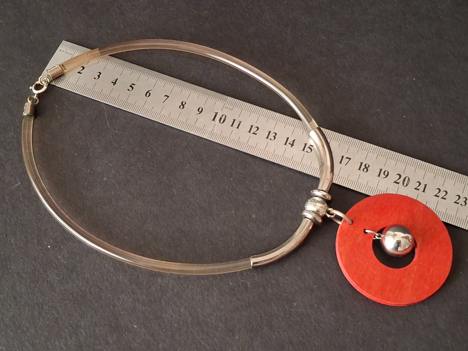 Aarikka Finland necklace with a vibrant red wooden ring pendant