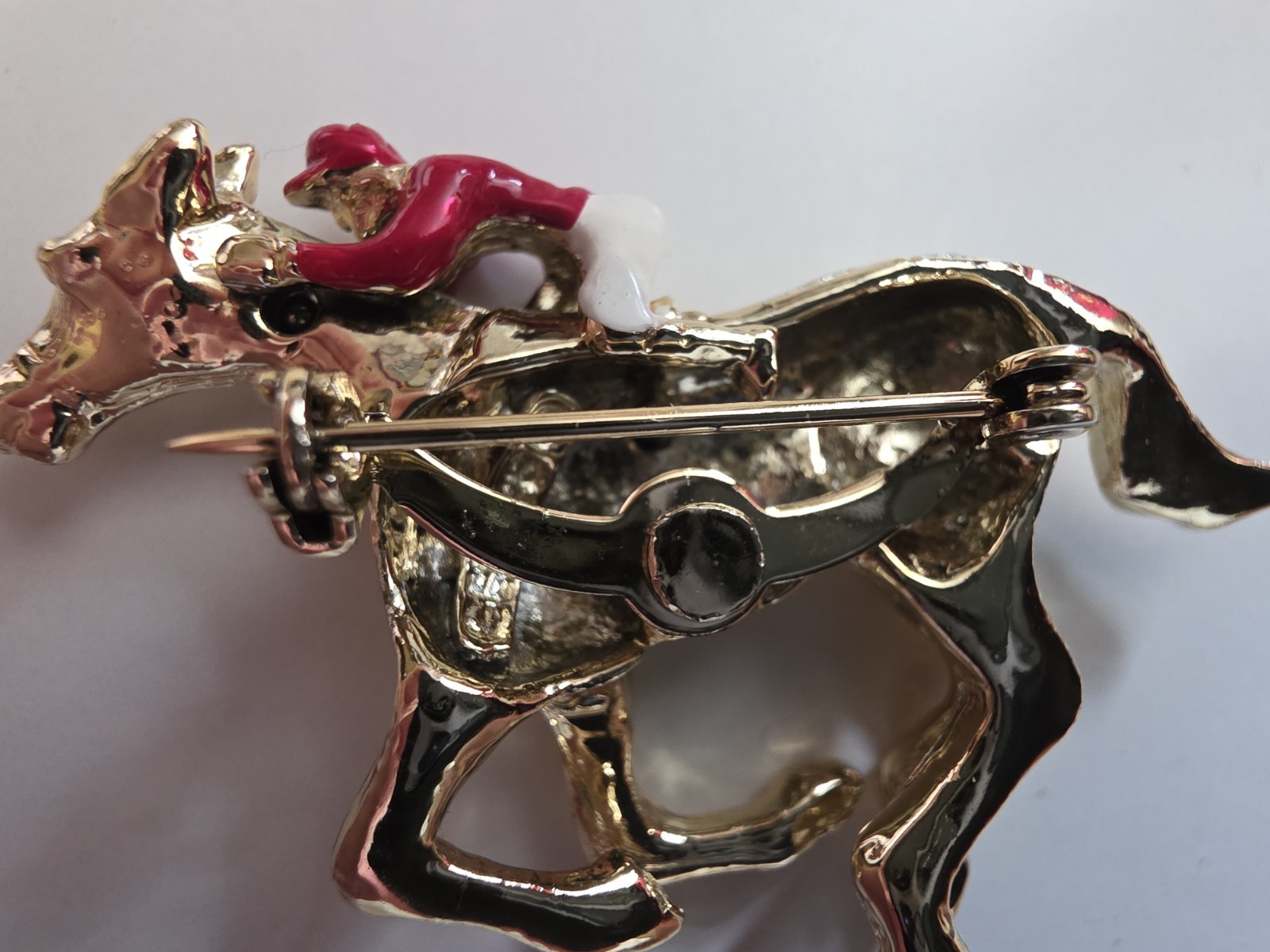 Vintage Red and White Enamel Jockey on Gold Horse Pin