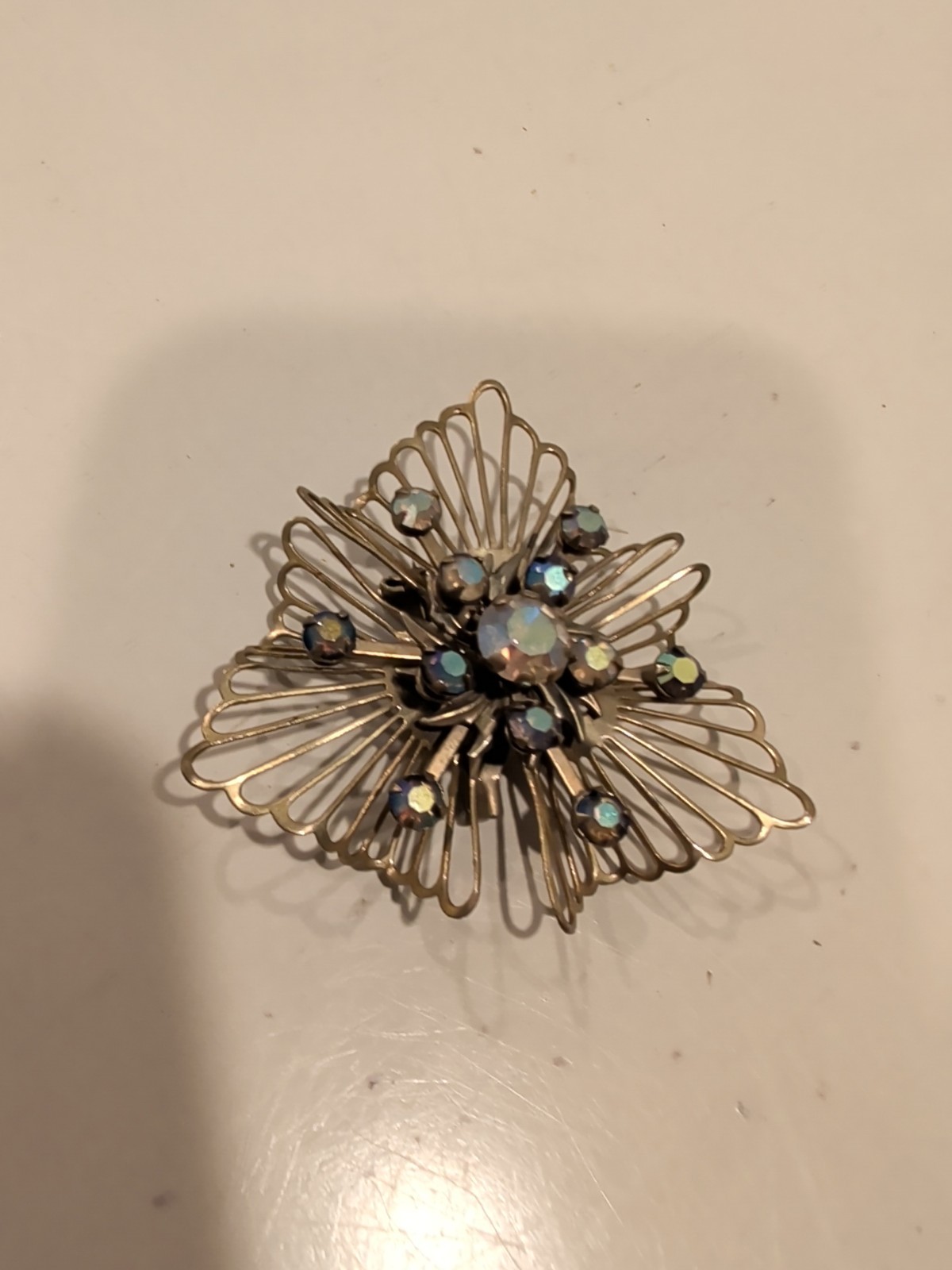 Vintage Coro or Kramer starburst brooch with aurora borealis rhinestones. USA.