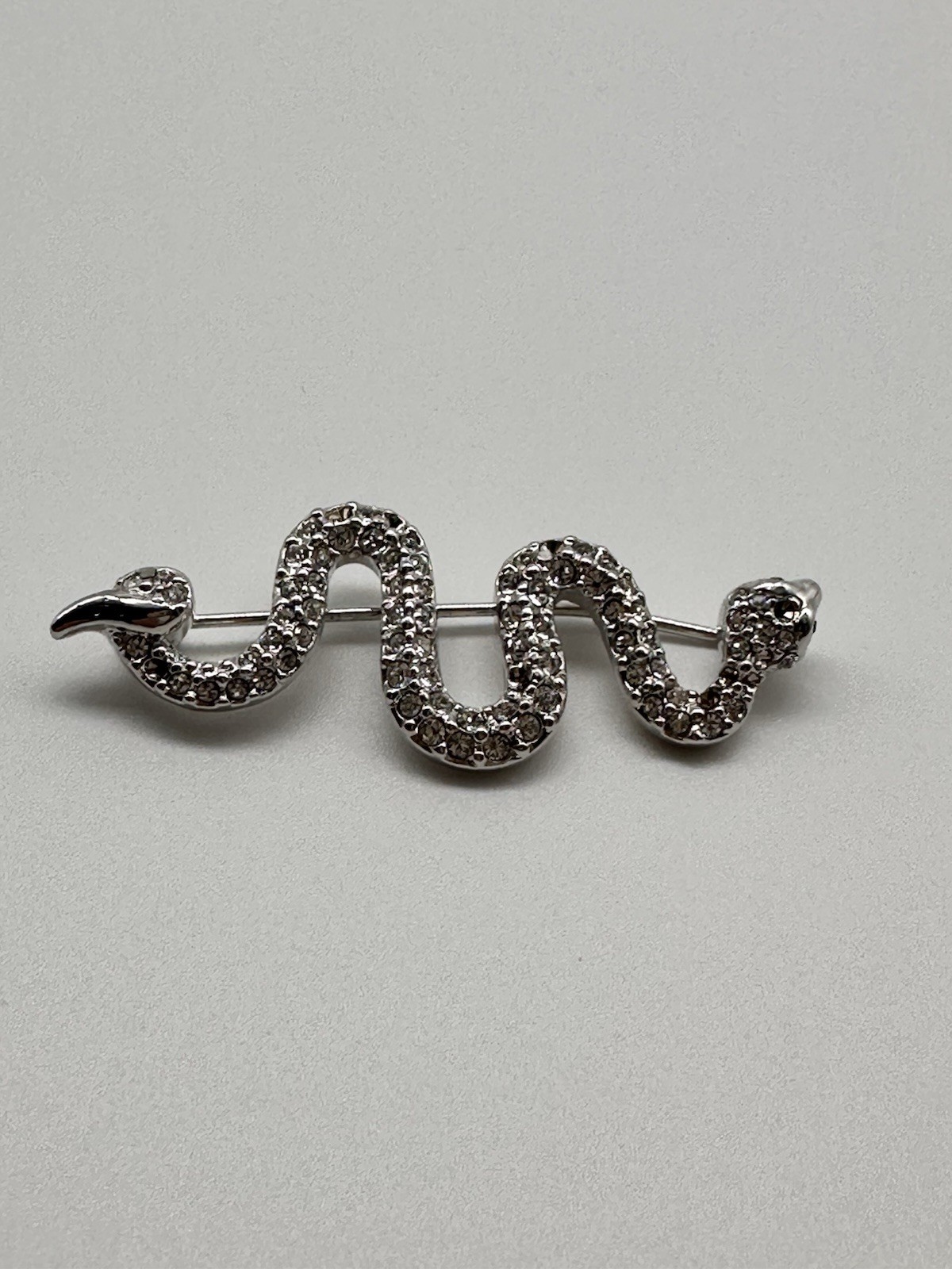 Vintage Swarovski Swan Silver tone Pave Crystal Snake brooch green eyes