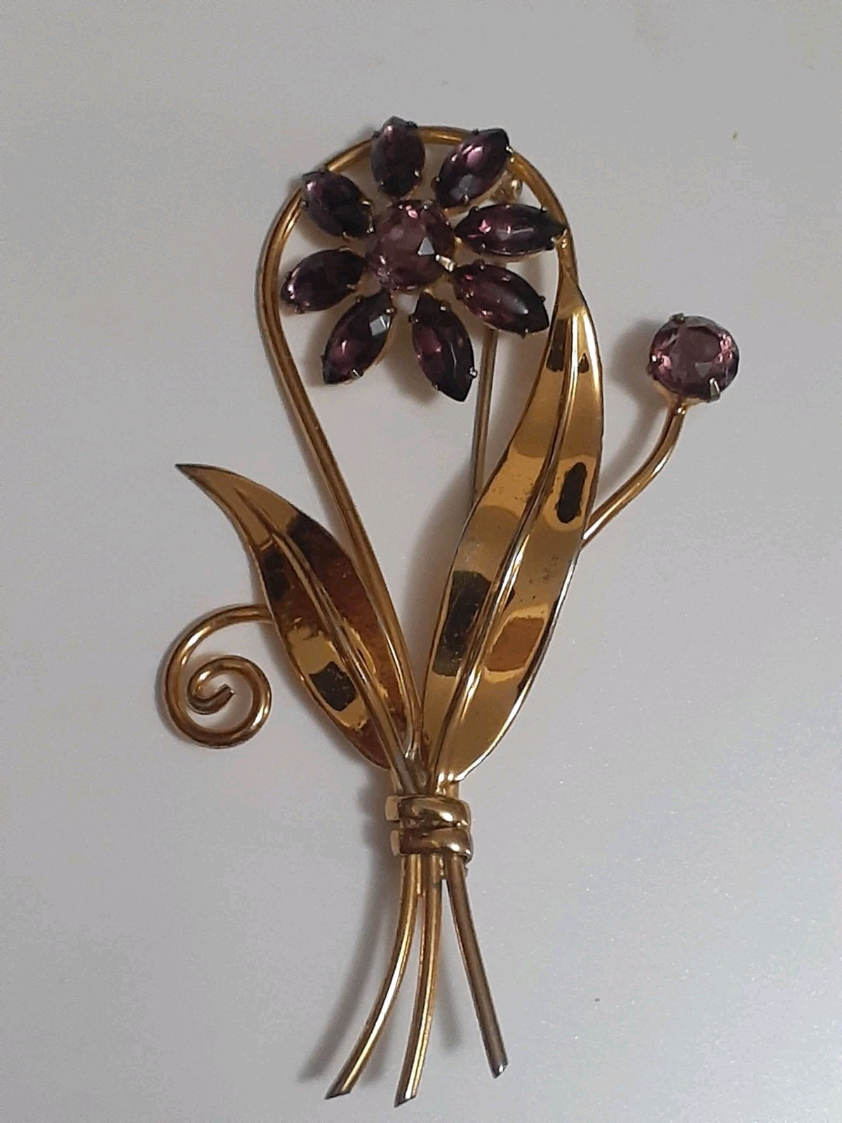 Sterling silver gold plated prong set purple glass flower & stem leaf brooch