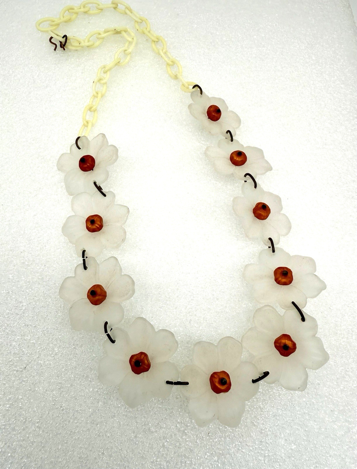 Vintage Lucite or acrylic whitish flowers with orange centers necklace