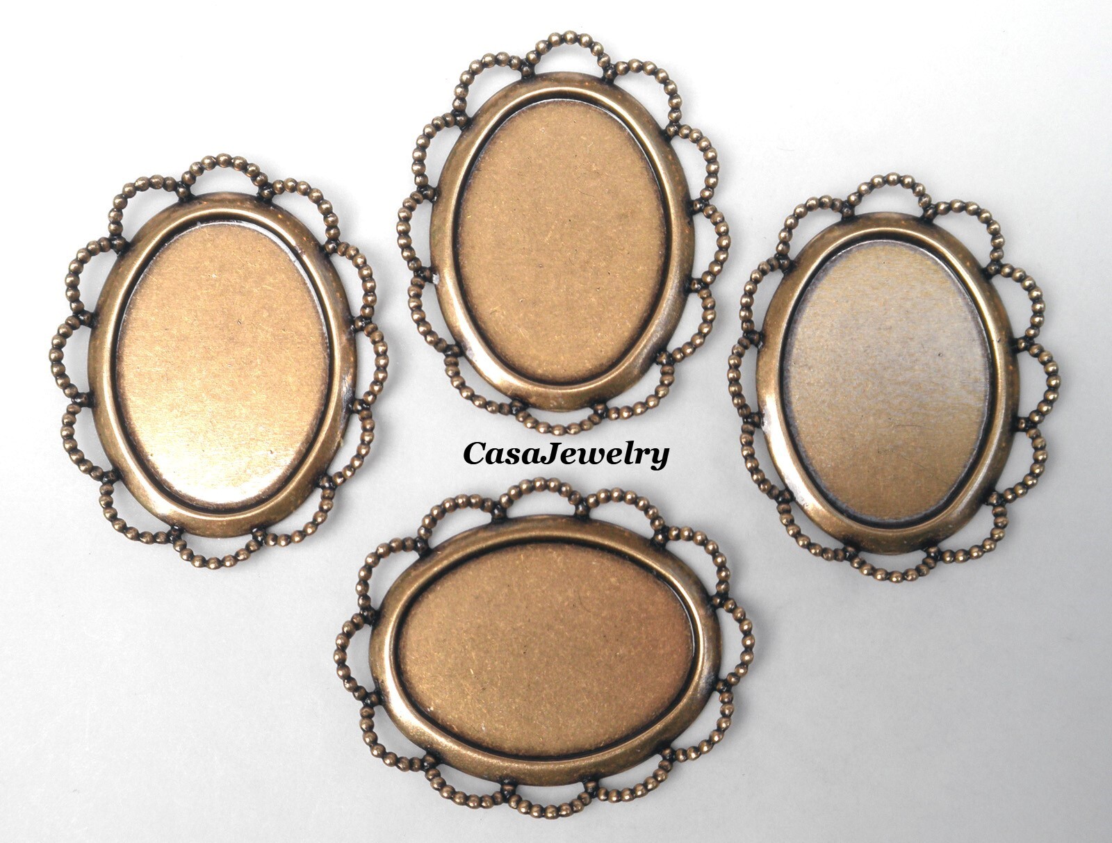 #1407 ANTIQUED GOLD 25x18MM BEZEL W/RAISED LACE BORDER – 4 Pc Lot