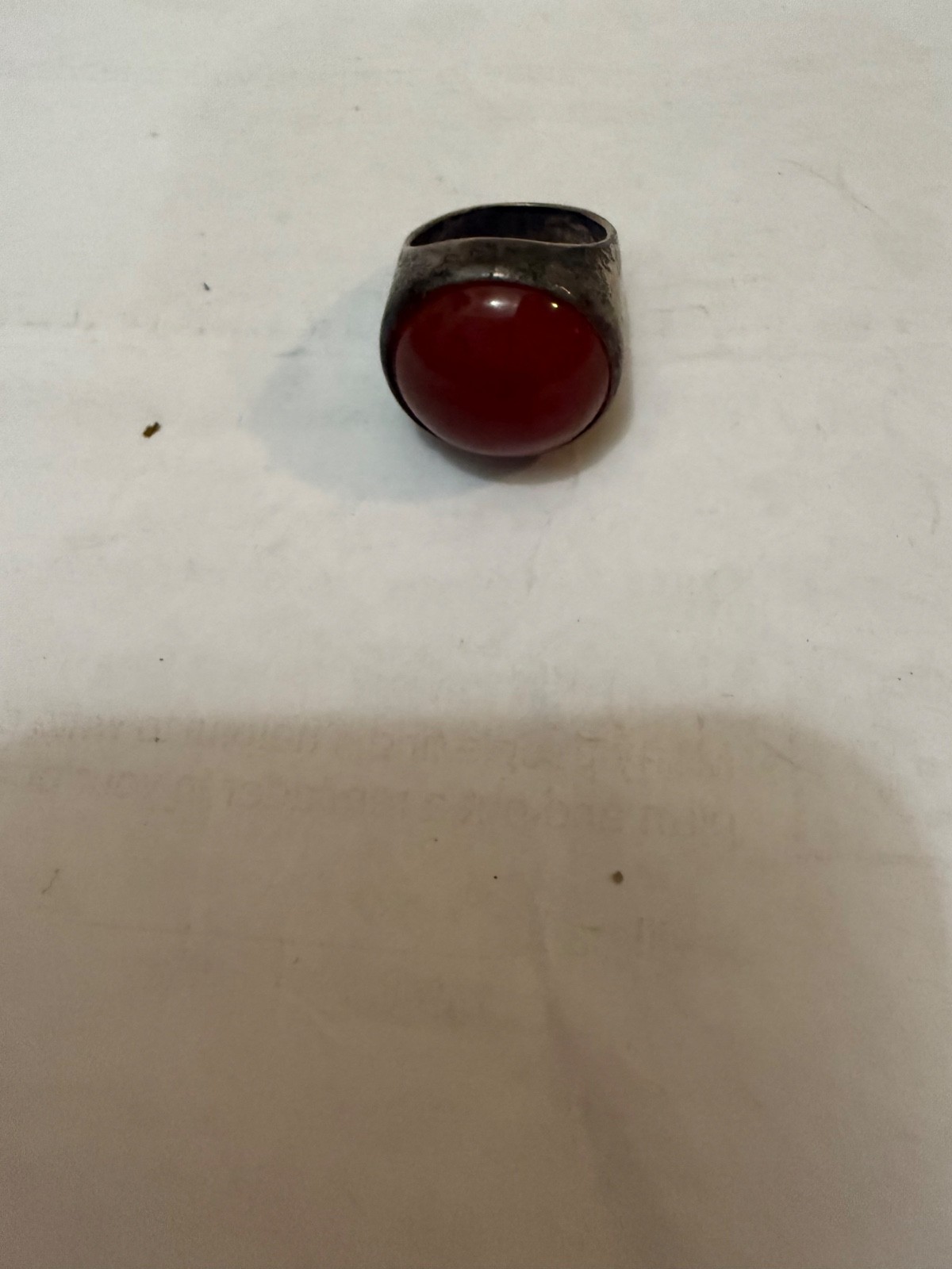 vintage silver dome-style cocktail ring featuring a prominent, smooth red caboch