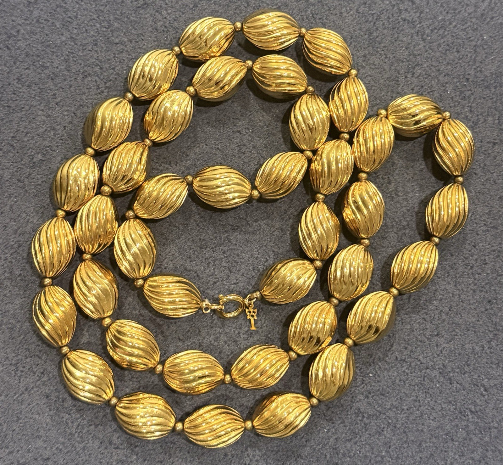 Signed Crown Trifari Vintage Gold Tone Ribbed Oval Bead Opera Long Necklace