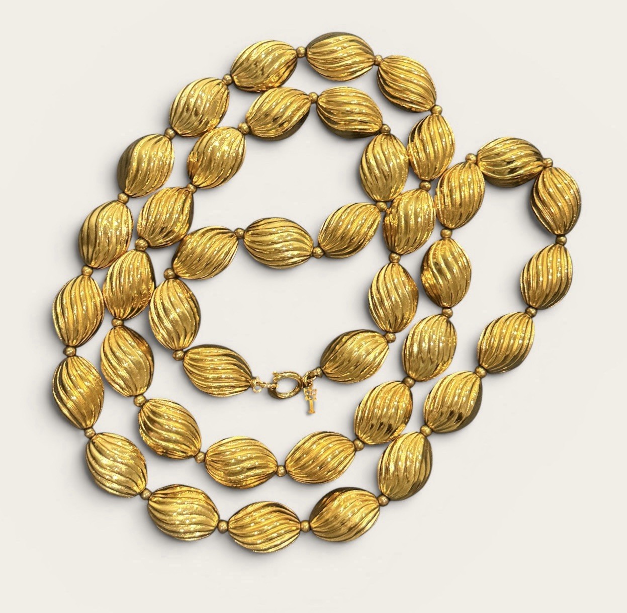Signed Crown Trifari Vintage Gold Tone Ribbed Oval Bead Opera Long Necklace