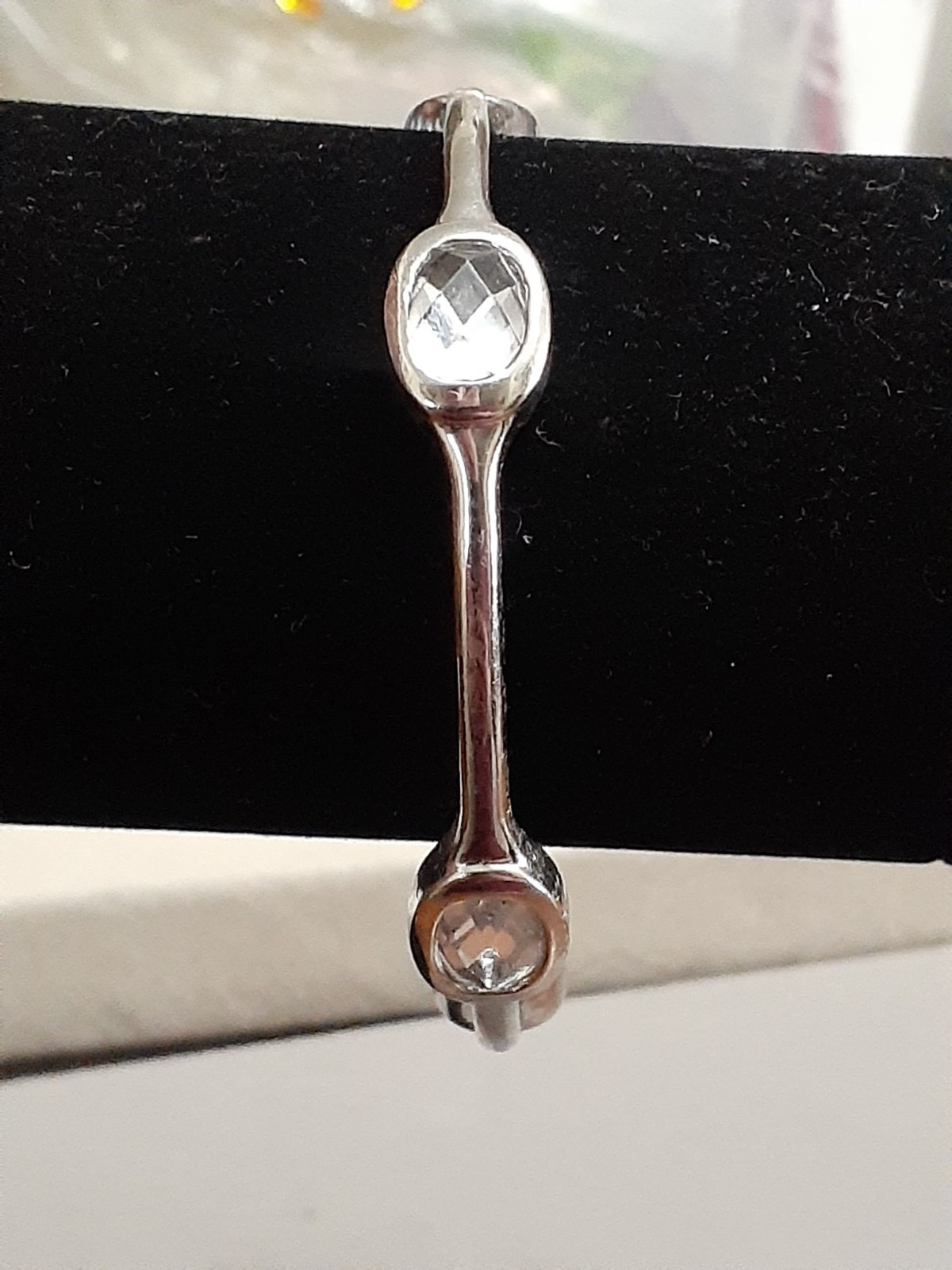 Fauceted crystal accent bangle bracelet Silvertone bezel set stones