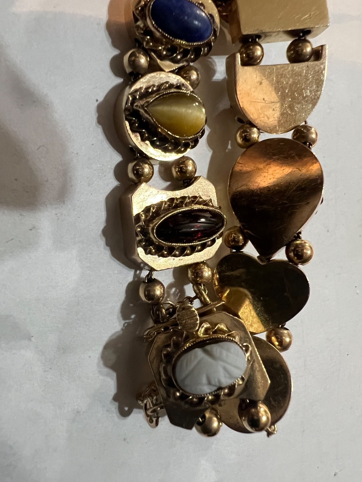 14k Gold ANTIQUE VICTORIAN GOLD CHARMS SLIDE BRACELET. CIRCA (1837-1901)