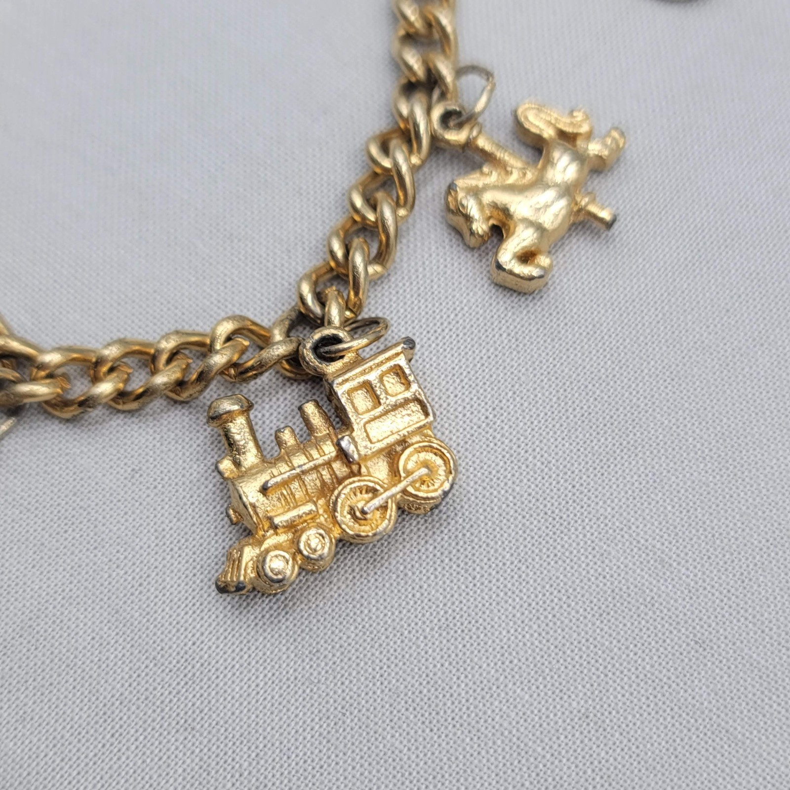 Vintage Charm Bracelet Gold tone Estate Costume 7 Dangle Charms 6.5″