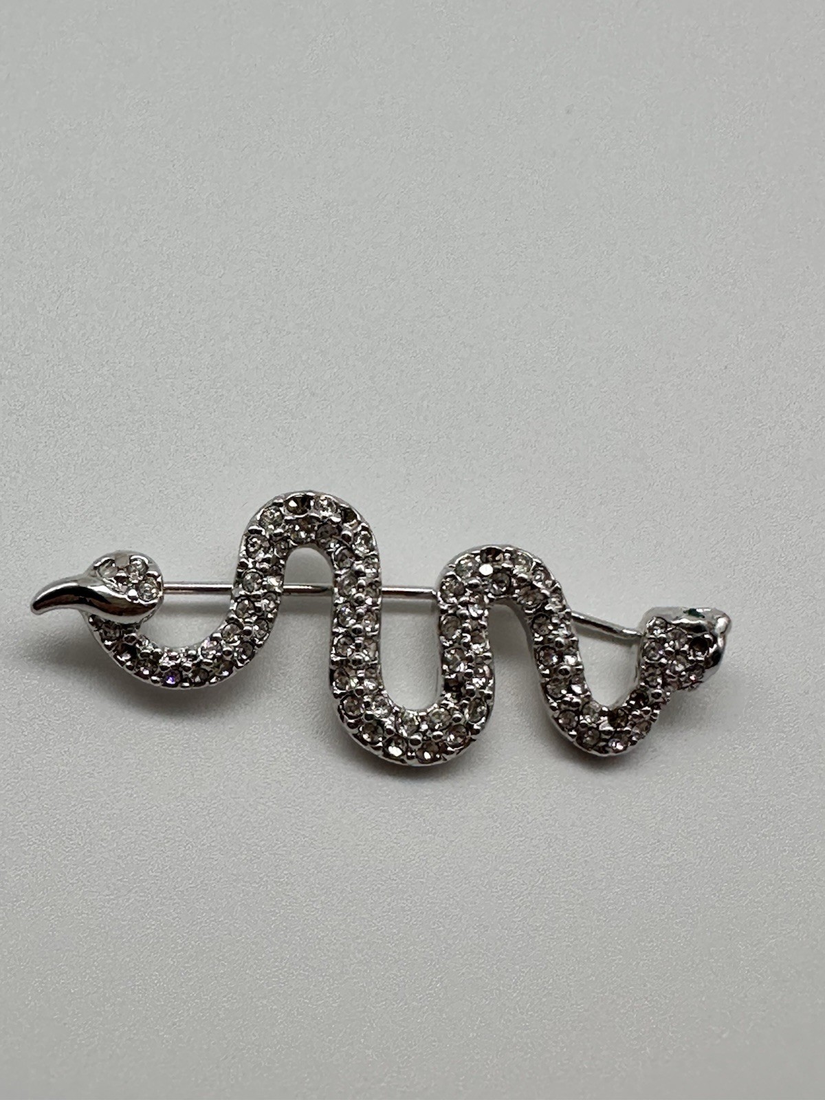 Vintage Swarovski Swan Silver tone Pave Crystal Snake brooch green eyes