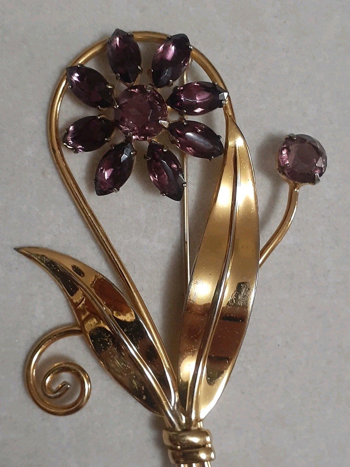 Sterling silver gold plated prong set purple glass flower & stem leaf brooch