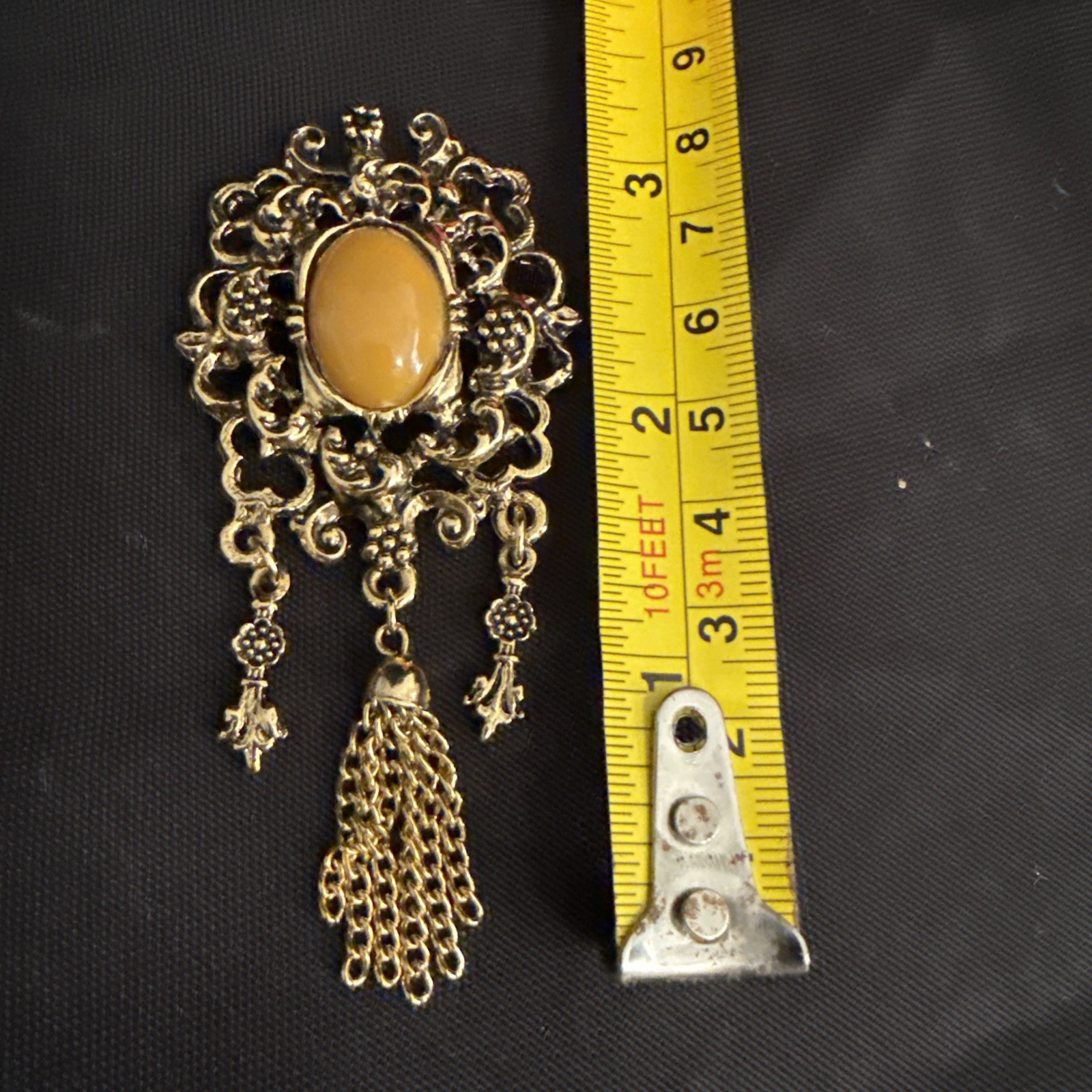 Vintage Gold Tone Dangle Brooch with Brown Cabochon Accent and Tassel Chain