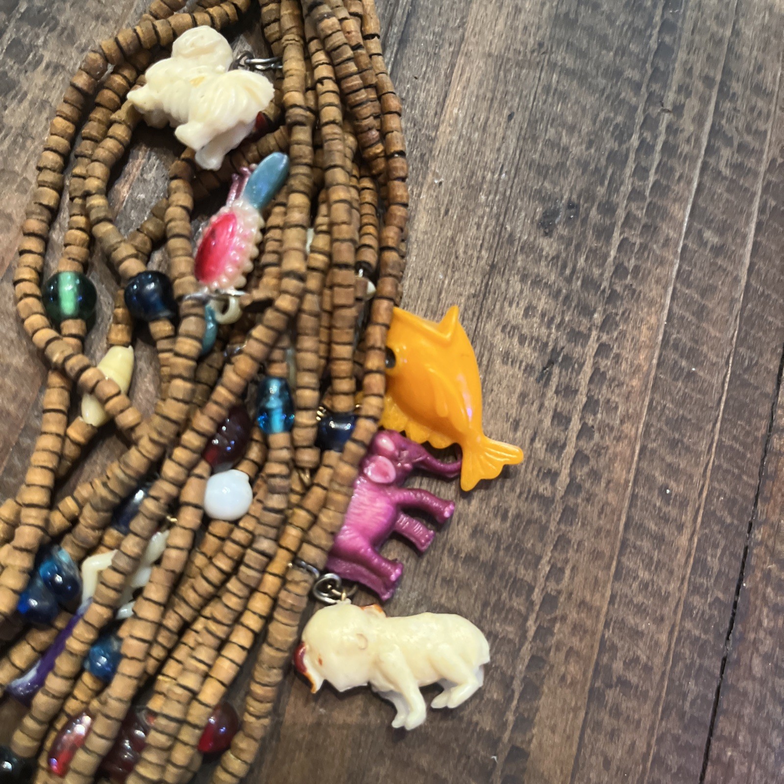 Vintage one of a kind wood bead Necklace w/ tons of celluloid charms unique cool
