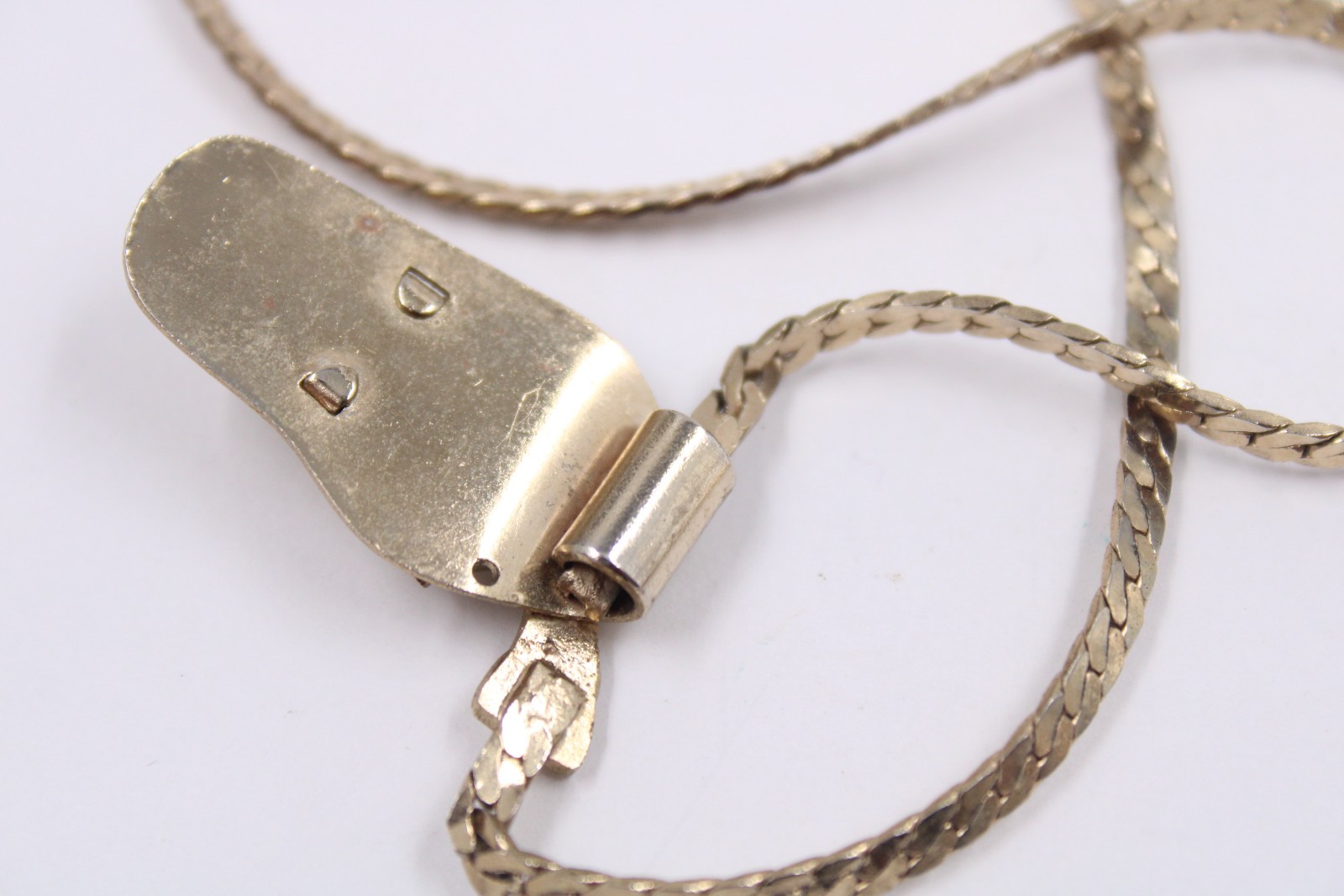 Gun-in-holster pendant necklace Mini revolver charm herringbone necklace 12″