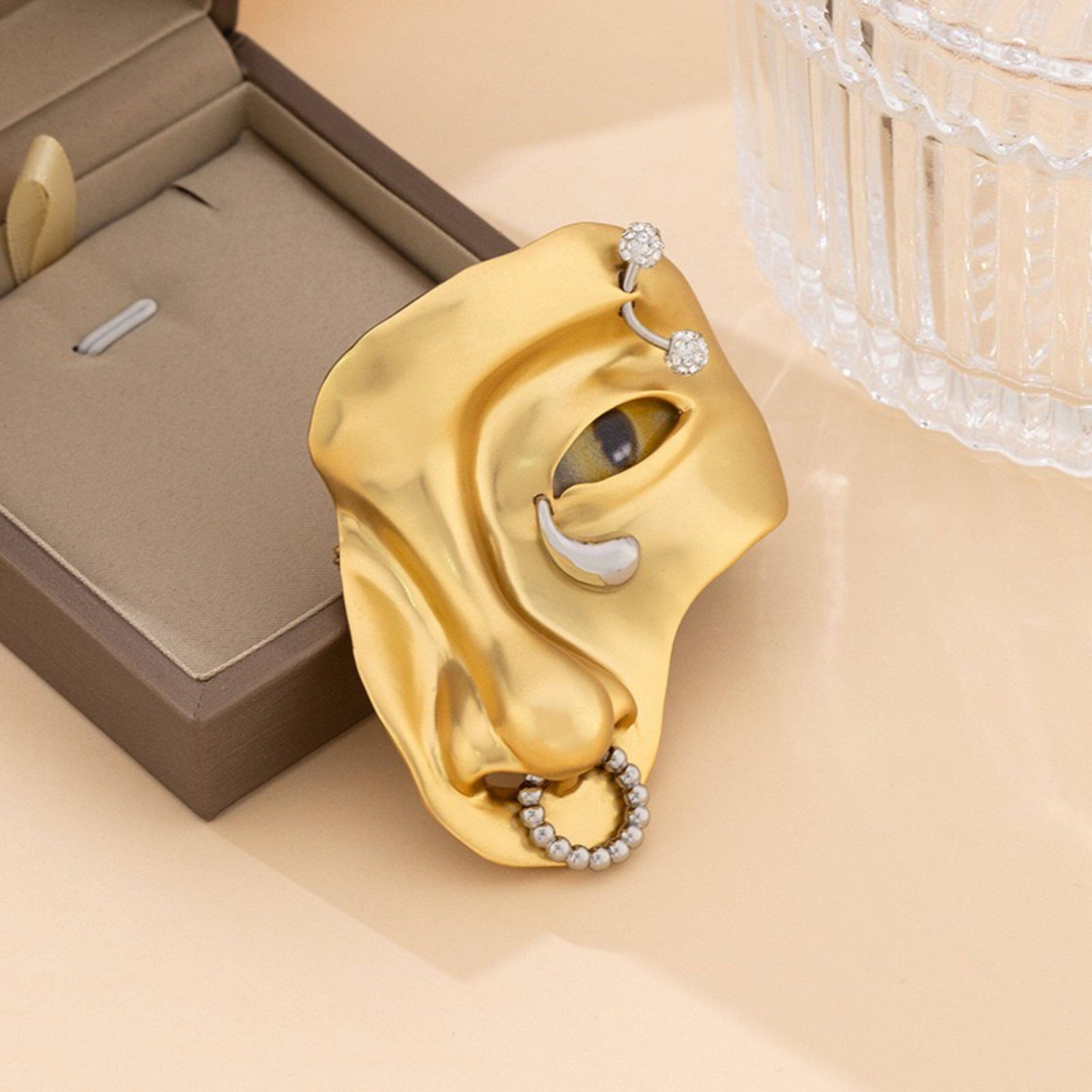 Schiaparelli yellow eye nose brooch with box