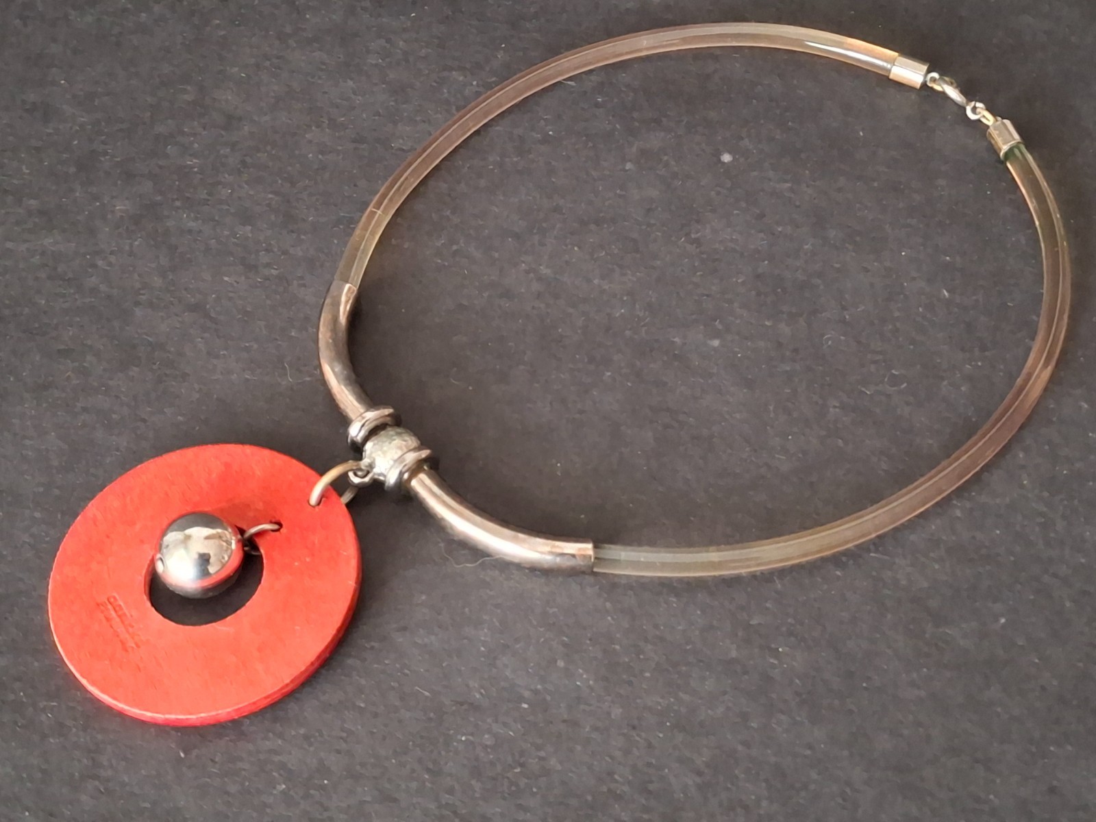 Aarikka Finland necklace with a vibrant red wooden ring pendant