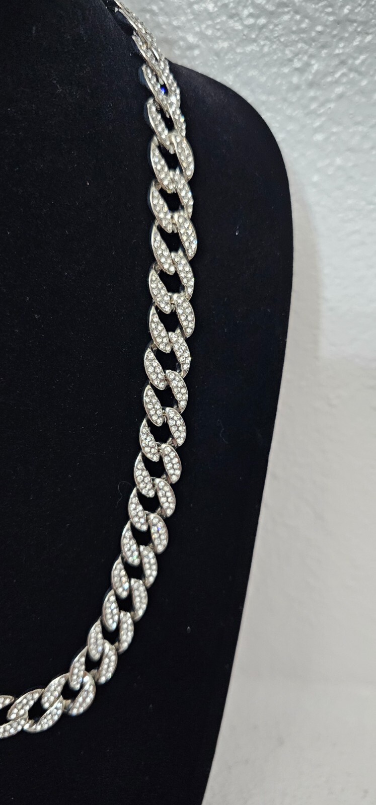 Cuban chain necklace silver tone one side many crystals other side plain.