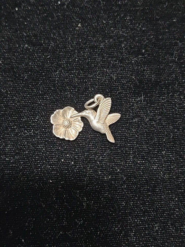 Retired James Avery hummingbird and flower sterling charm