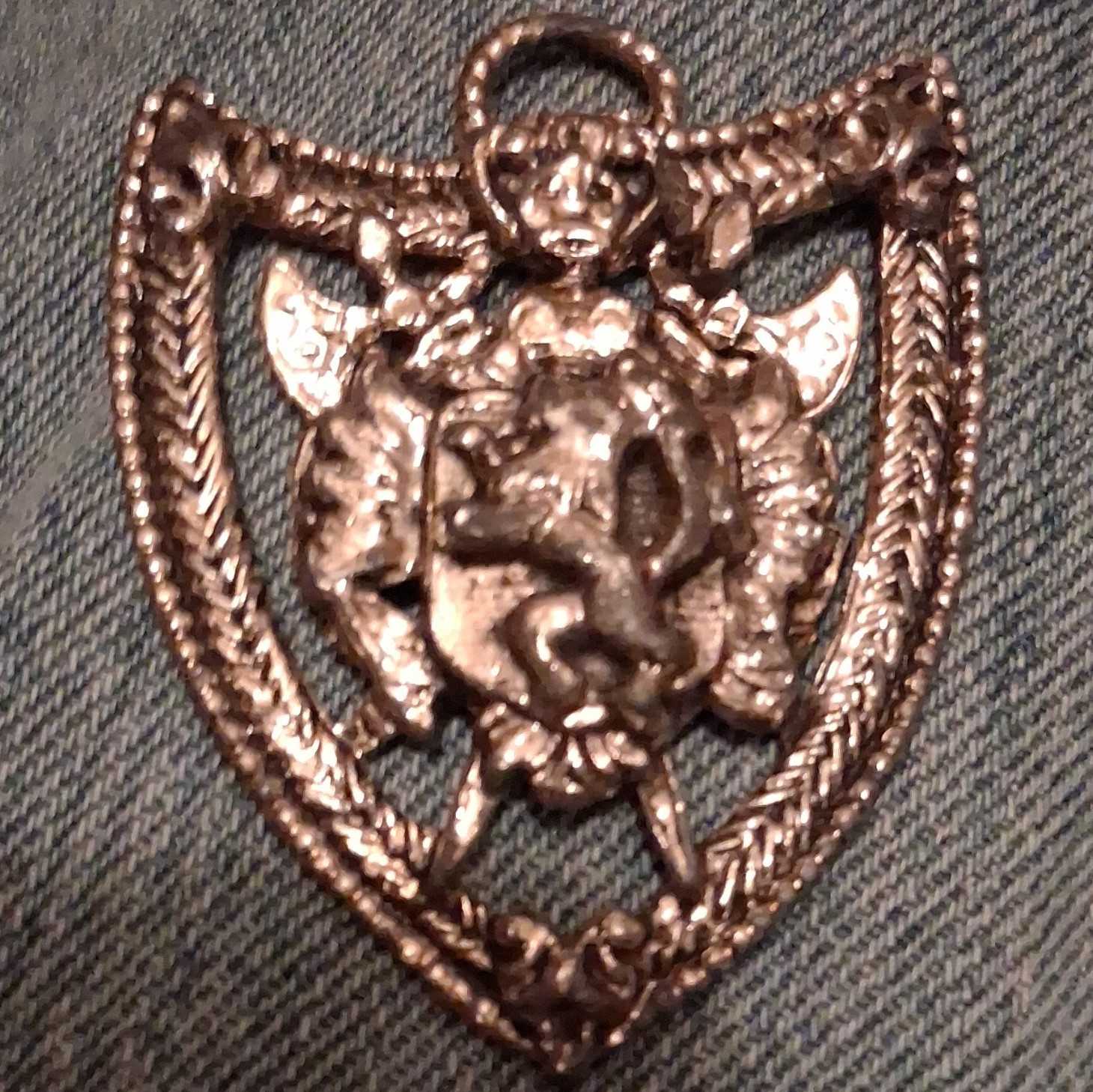 Silver Tone Shield Pin with Raised Animal Head Design, No Stone