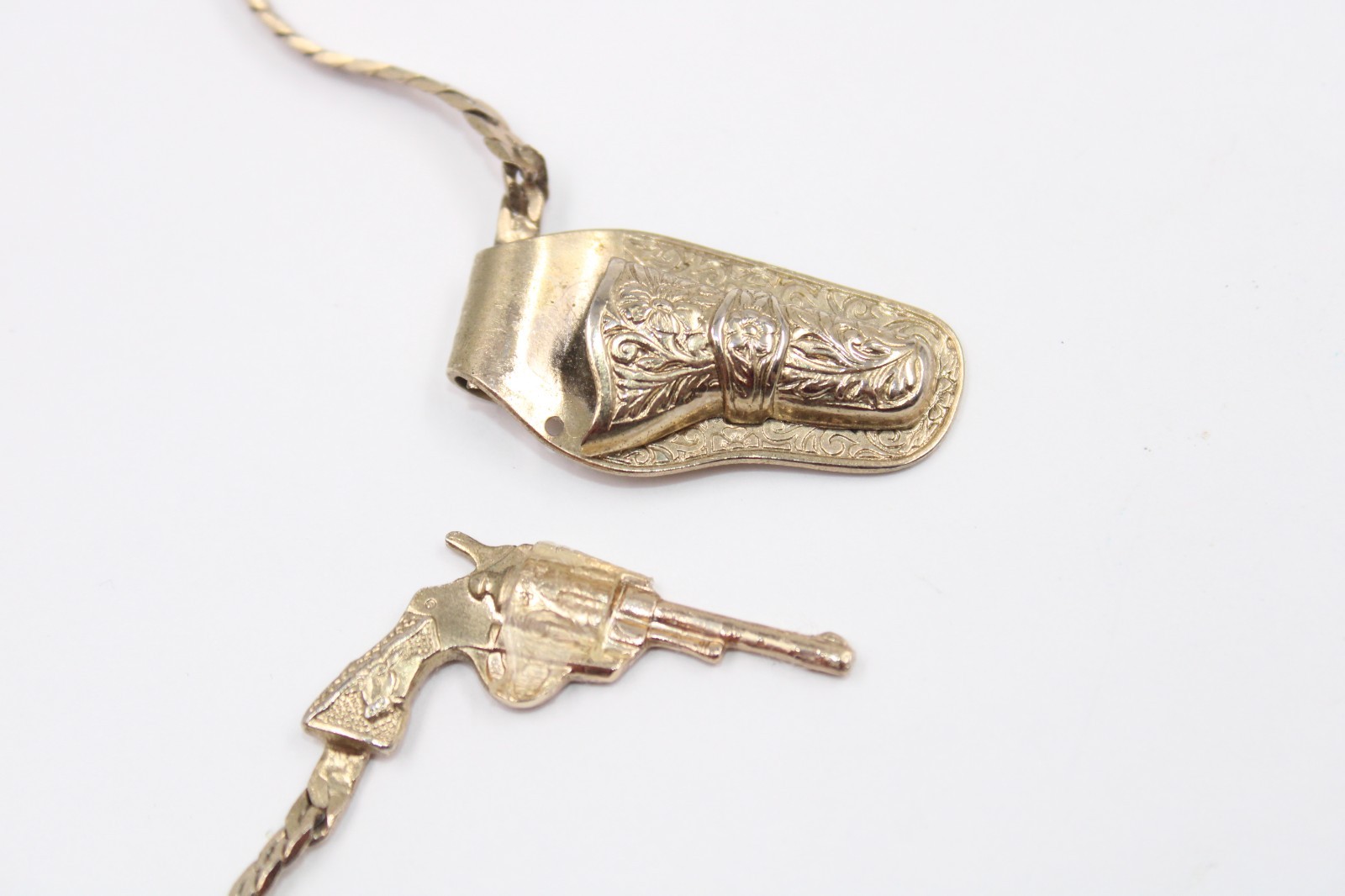 Gun-in-holster pendant necklace Mini revolver charm herringbone necklace 12″