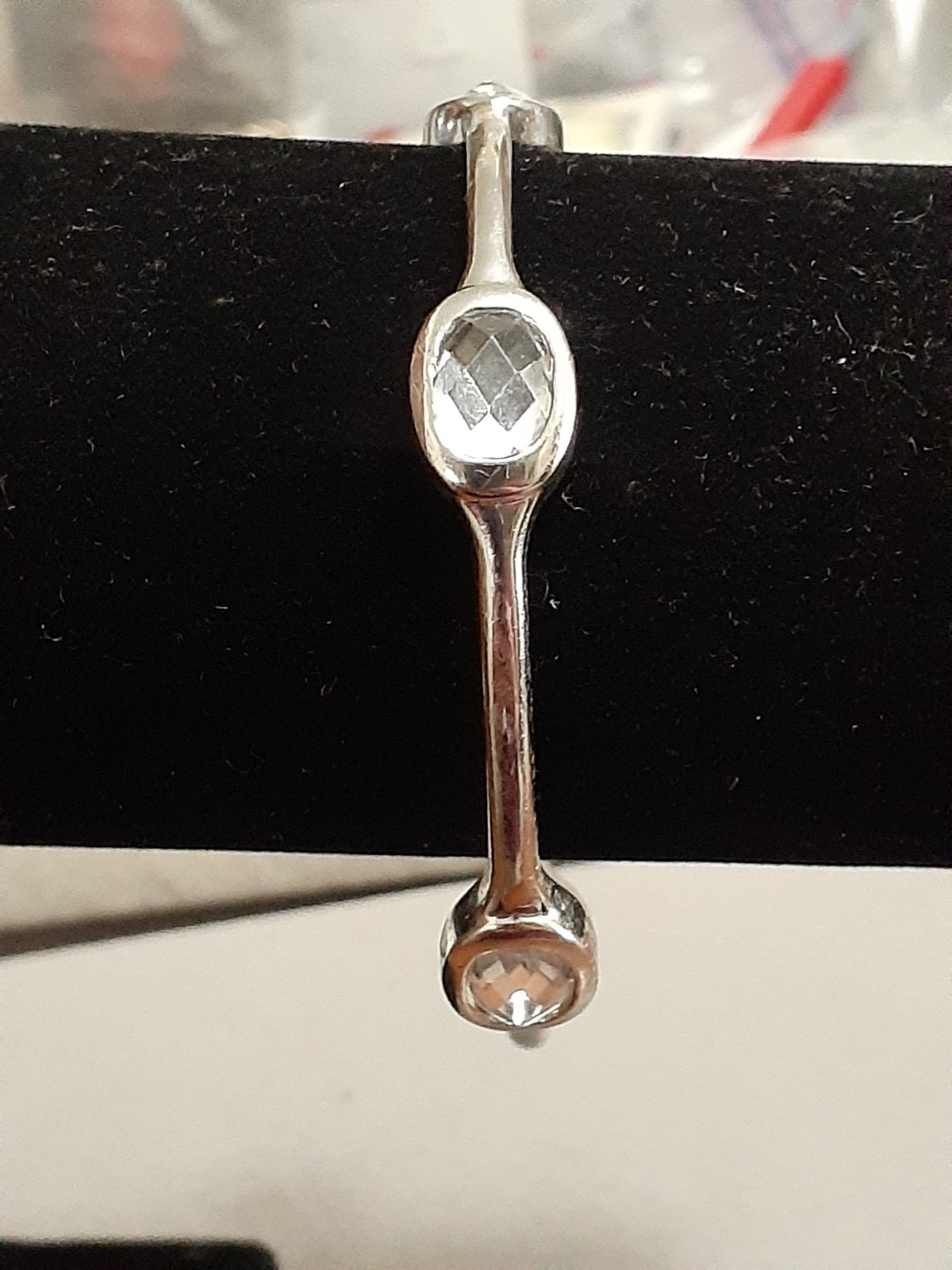 Fauceted crystal accent bangle bracelet Silvertone bezel set stones