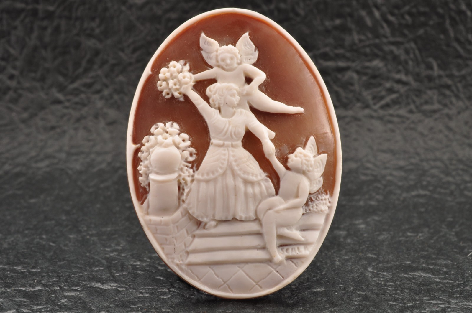 Vintage oval shell cameo, “Girl and angel”, (45.5ct) sign by artist with case.