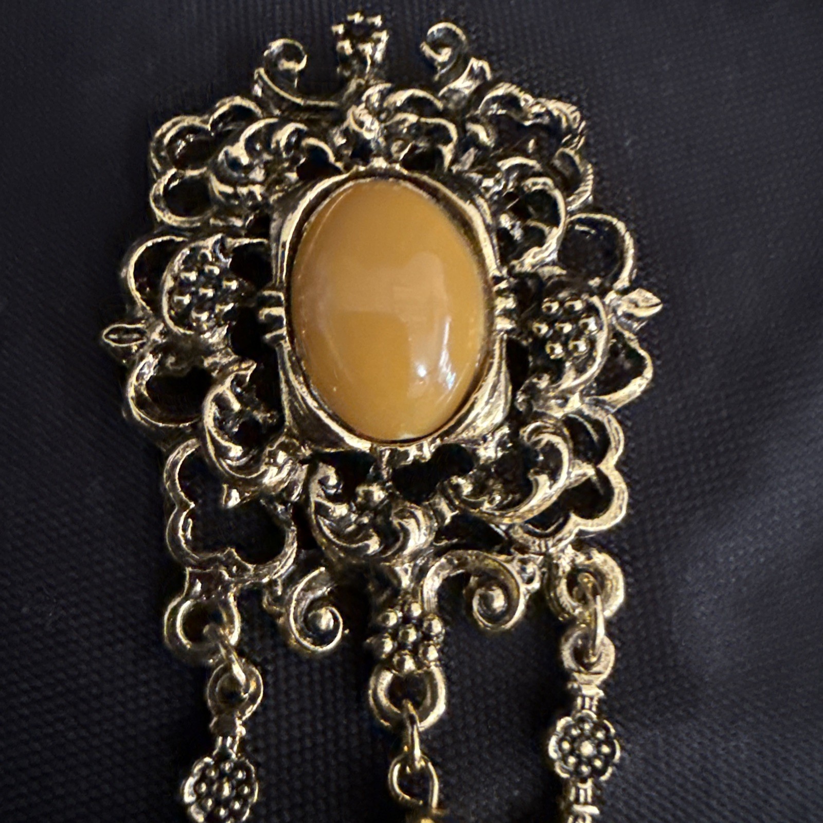 Vintage Gold Tone Dangle Brooch with Brown Cabochon Accent and Tassel Chain