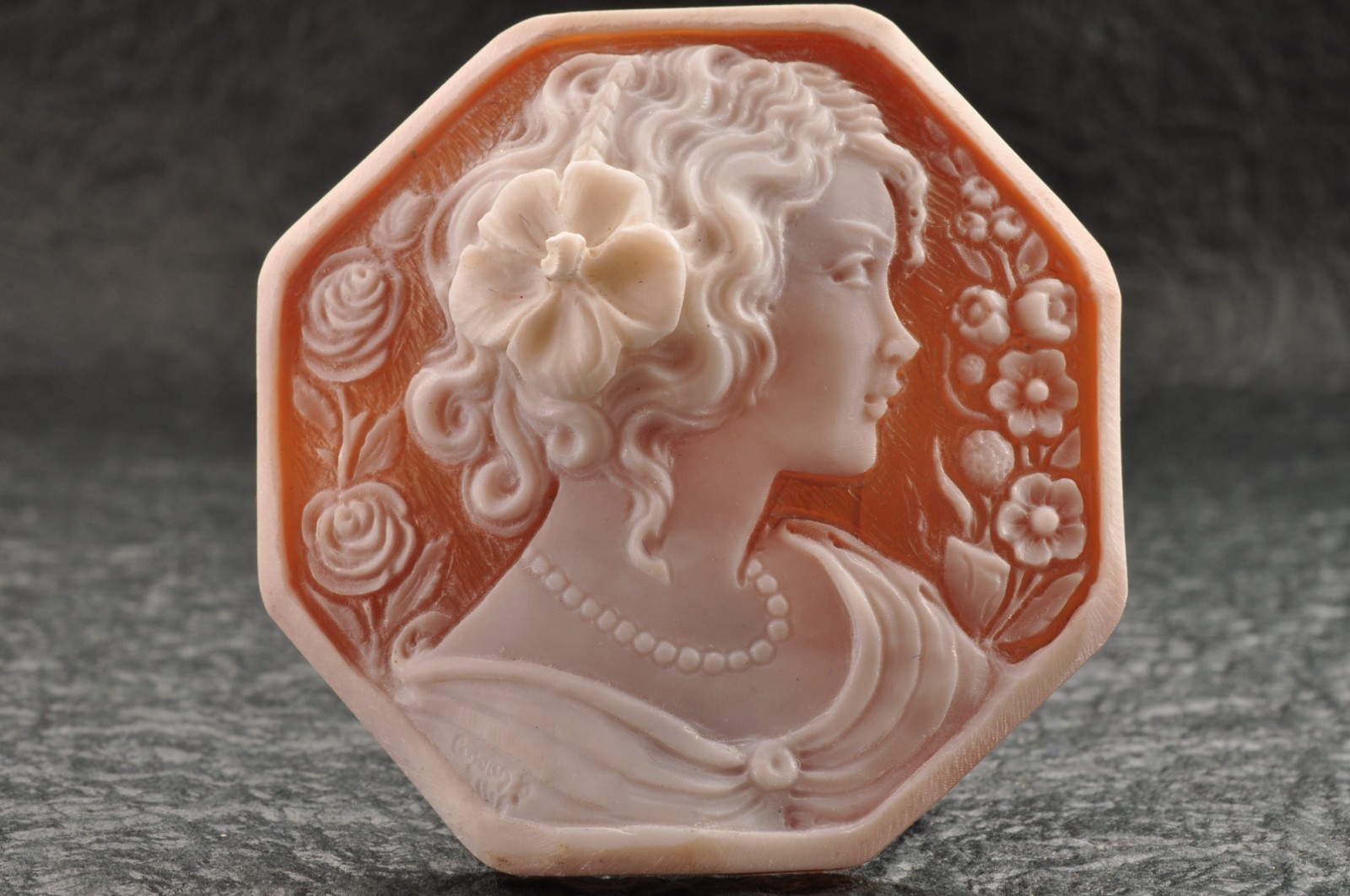 Vintage shell cameo “Girl with a flower hair ornament”, (65.0ct) sign by artist.