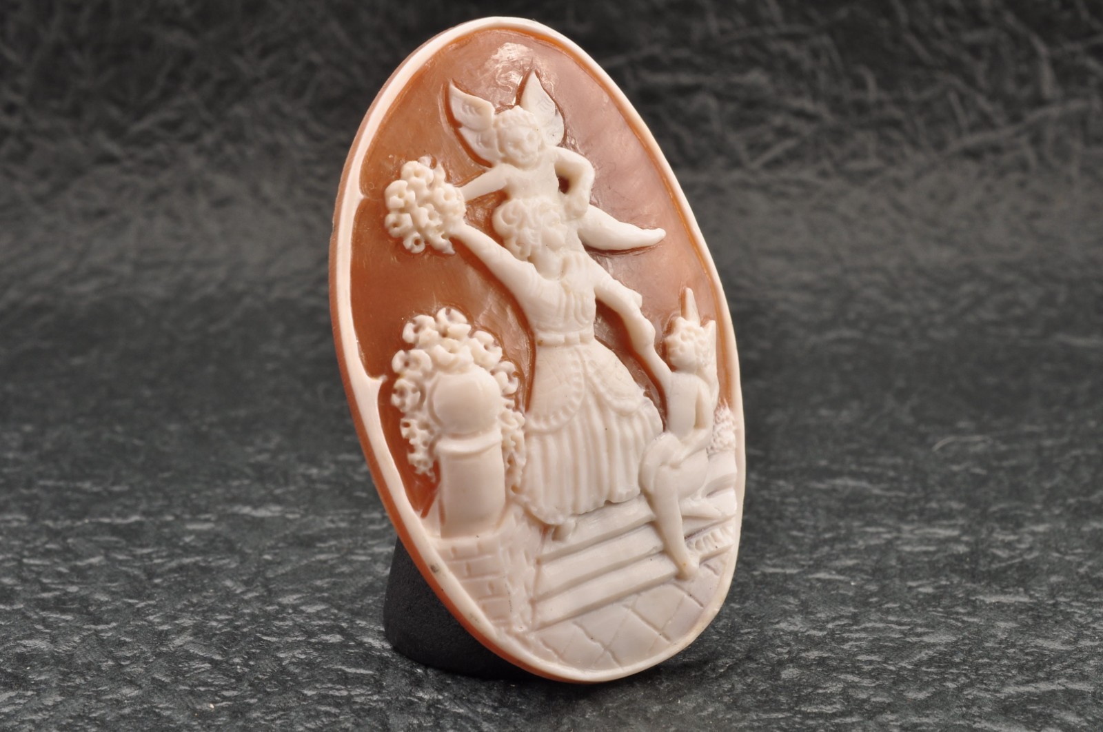Vintage oval shell cameo, “Girl and angel”, (45.5ct) sign by artist with case.