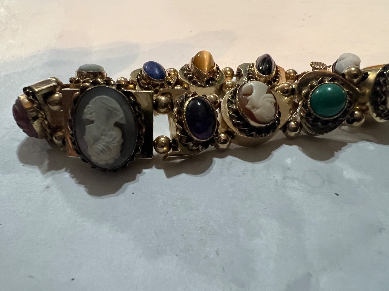 14k Gold ANTIQUE VICTORIAN GOLD CHARMS SLIDE BRACELET. CIRCA (1837-1901)