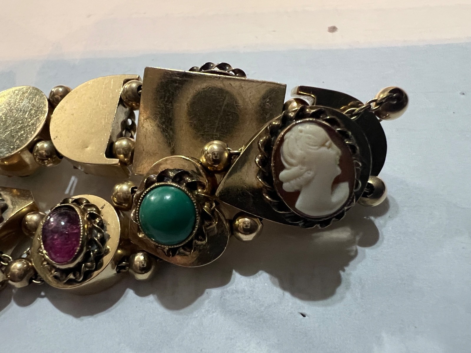 14k Gold ANTIQUE VICTORIAN GOLD CHARMS SLIDE BRACELET. CIRCA (1837-1901)