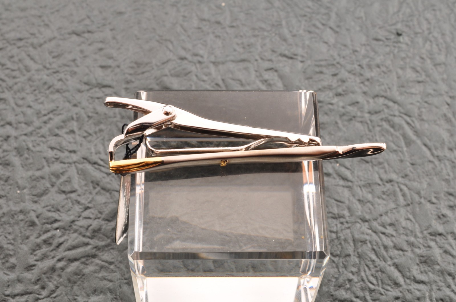 Near mint, gold and Cufflinks and silver tie clip, “Yves Saint Laurent”, case.