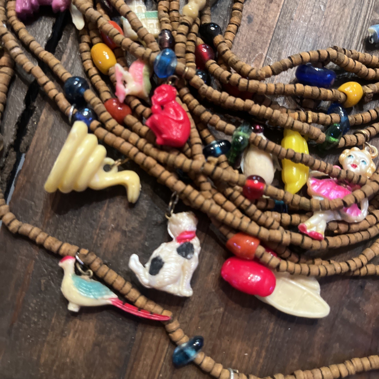 Vintage one of a kind wood bead Necklace w/ tons of celluloid charms unique cool