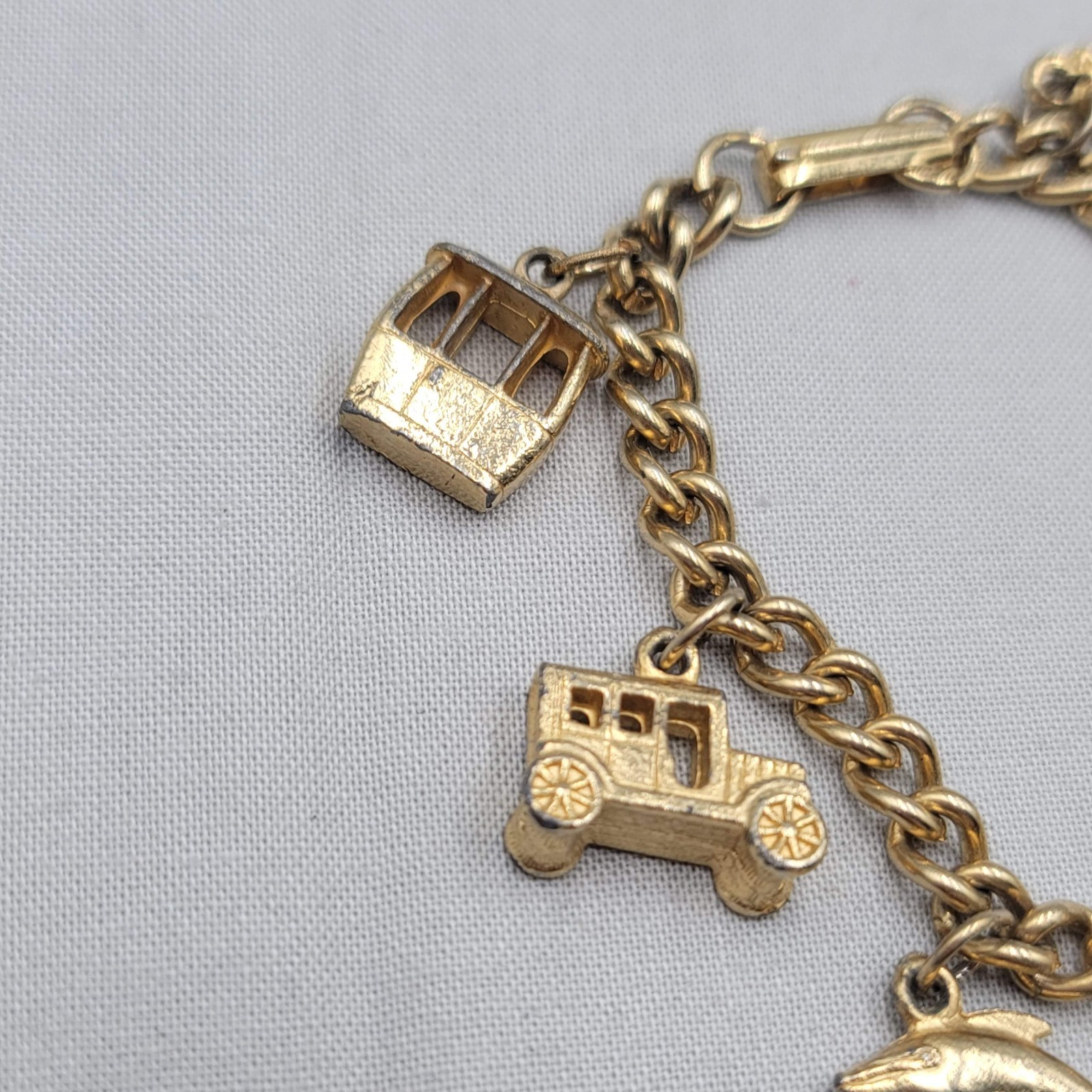 Vintage Charm Bracelet Gold tone Estate Costume 7 Dangle Charms 6.5″