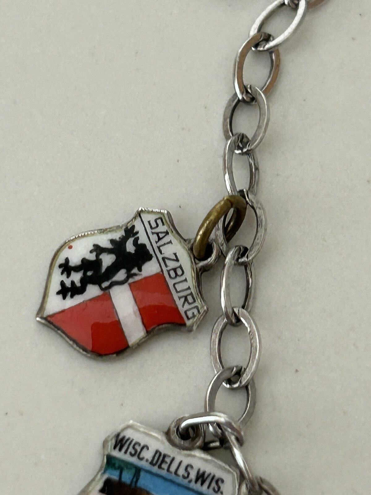 VINTAGE SOLID SILVER AND ENAMEL TRAVEL CHARM BRACELET6 COAT OF ARMS (8 TOTAL)