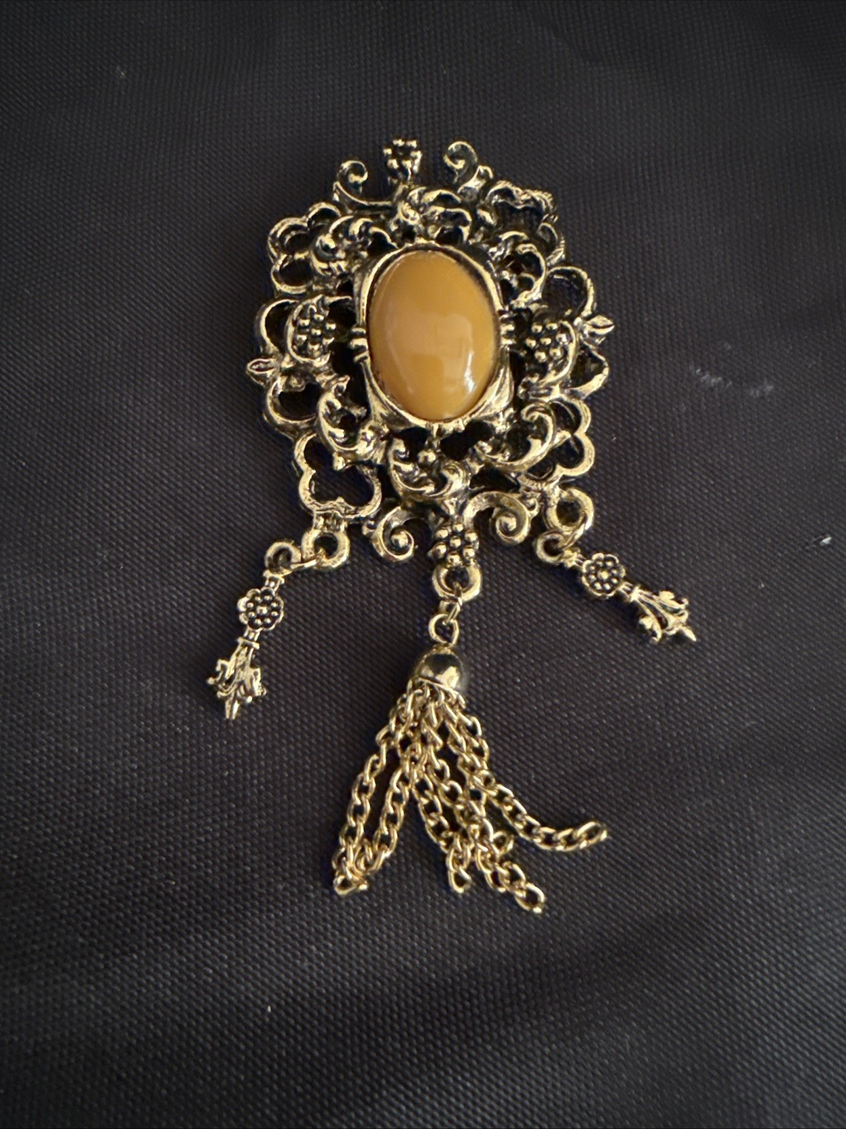 Vintage Gold Tone Dangle Brooch with Brown Cabochon Accent and Tassel Chain
